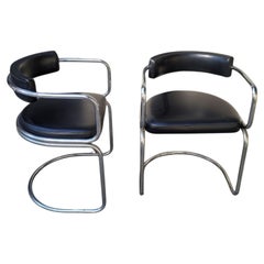 Pair of Bauhaus-style armchairs chromed steel frame and black leather seat