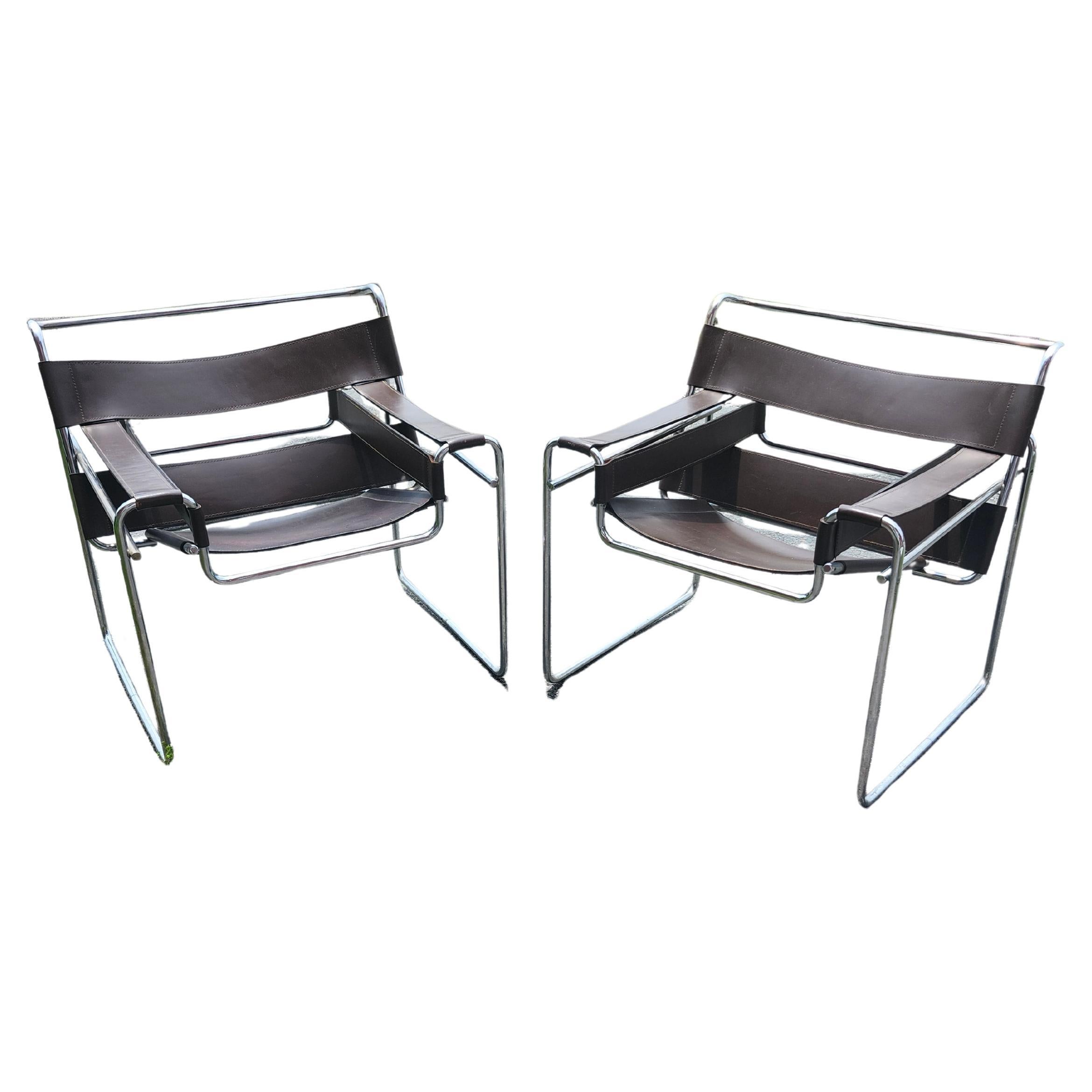 Fabulous pair of Mid Sixties Wassily lounge chairs designed by Marcel Breur during the Bauhaus Movement C1925. These are attributed to Knoll as they have the attributes,  saddle leather, welded caps, not plugs, correct age and wear, high
