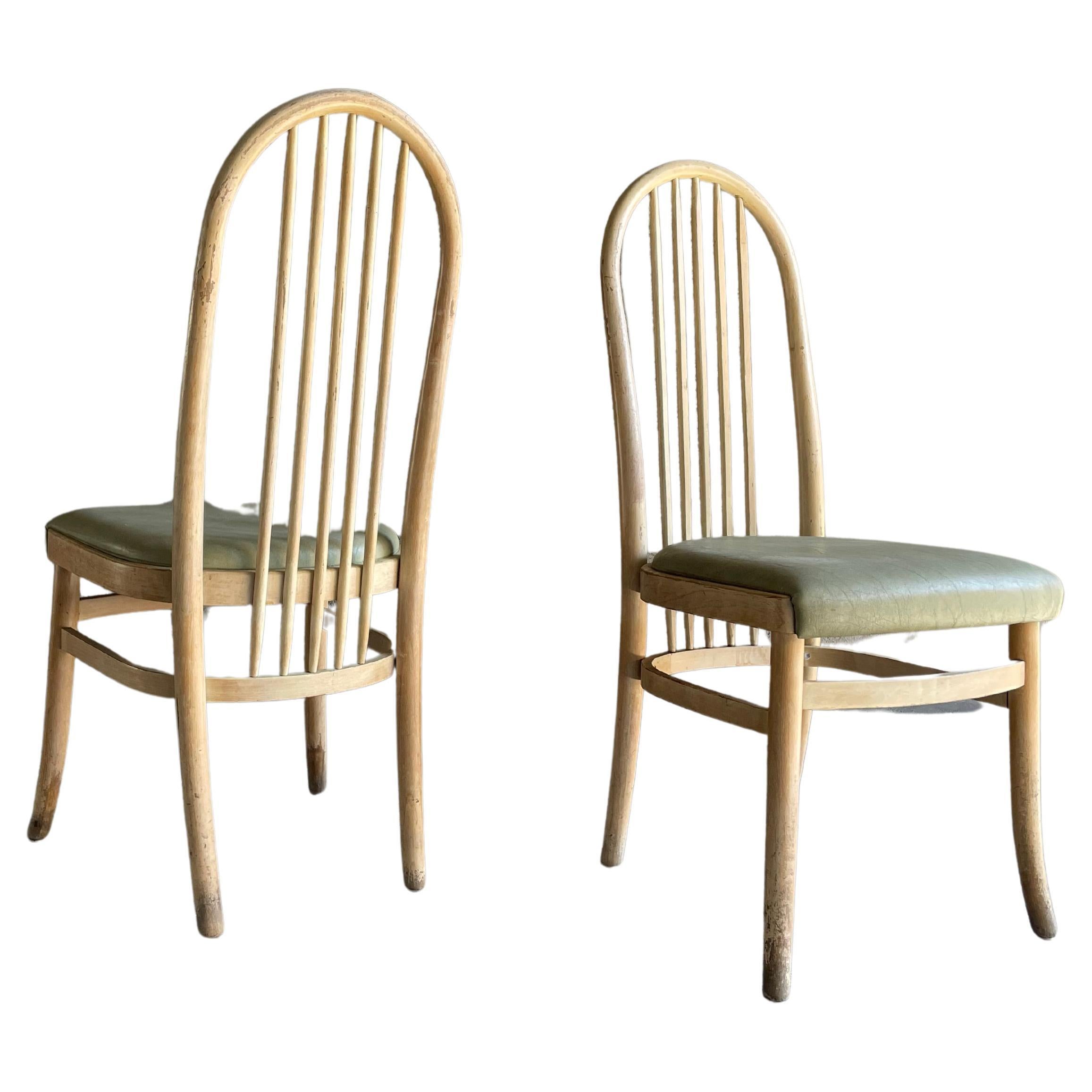 Pair of Baumann bistro chairs, France