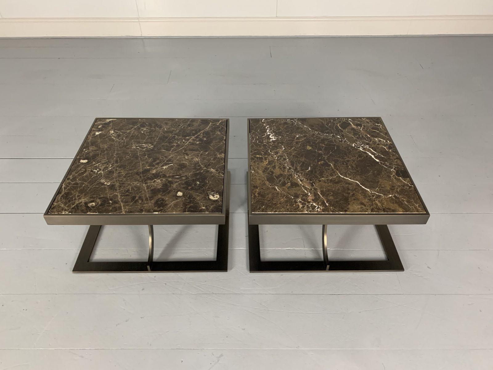 This is a spectacular, rare identical pair of “Paul” sofa/side/coffee tables from the world renown Italian furniture house of Baxter, with a laser-cut, burnished-bronze metal frame, and topped with spellbinding “Emperador” marble.

In a world of