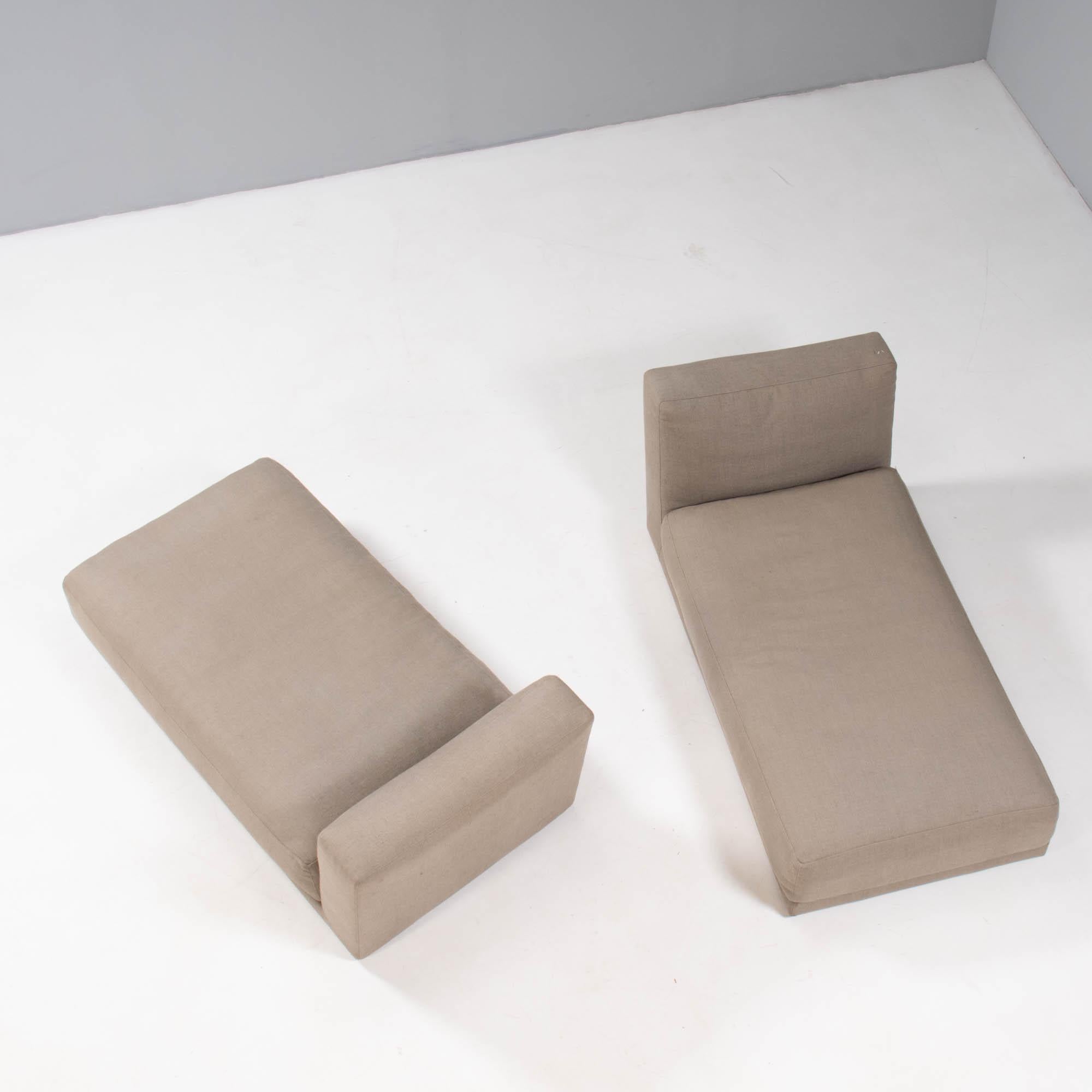Designed and made by B&B Italia, this pair of chaise longues have a slimline silhouette with generous seat cushions for the ultimate in comfort.

Fully upholstered in grey fabric, the seat cushion is separate, while the headboard is integrated