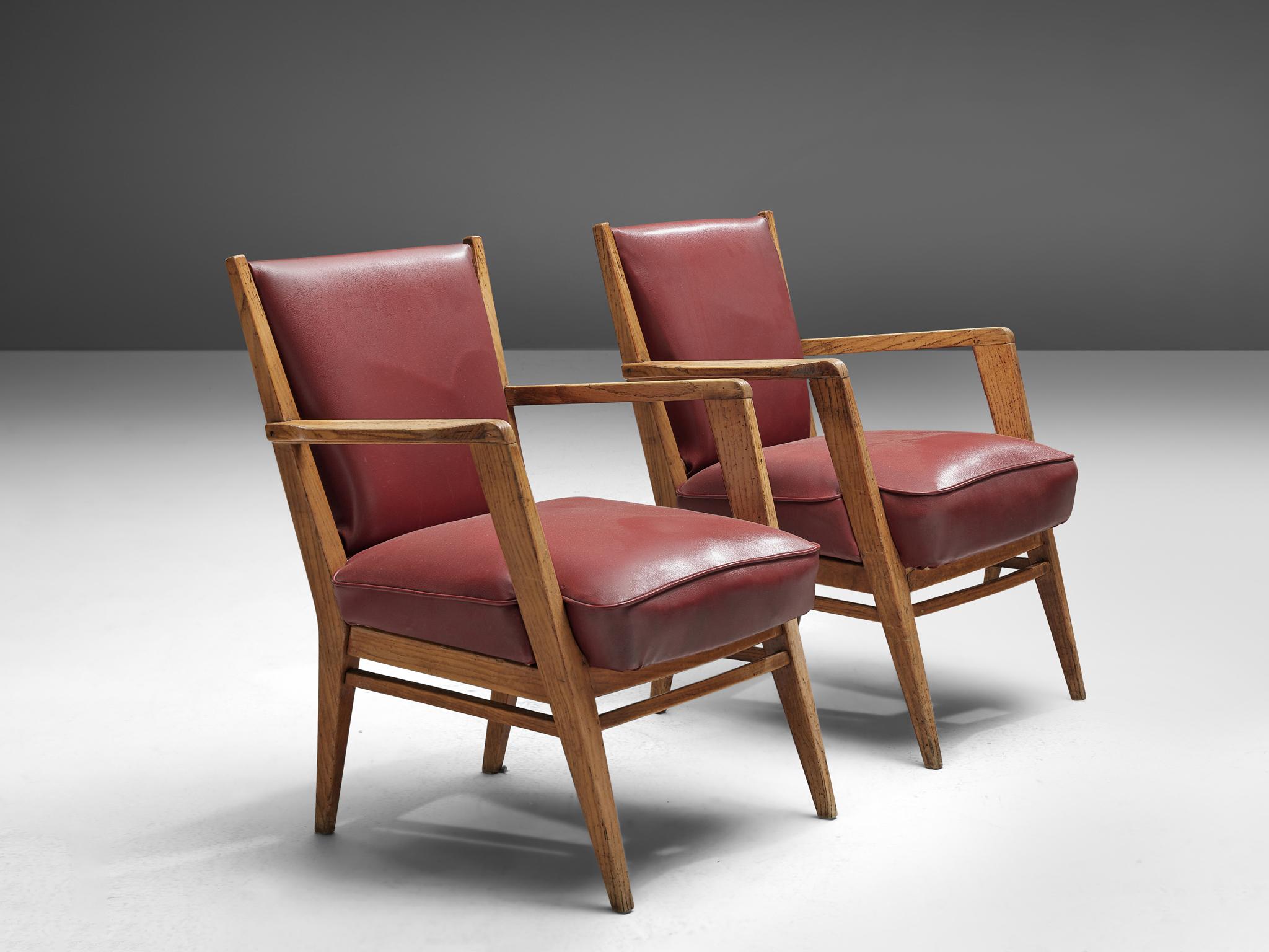 BBPR, pair of armchairs, skai leather and walnut, Italy, 1950s.

This sculptural pair of lounge chairs are clearly a design by the architects of BBPR. The model with a wide seat has the characteristic, sculptural frame. The tapered and titled legs