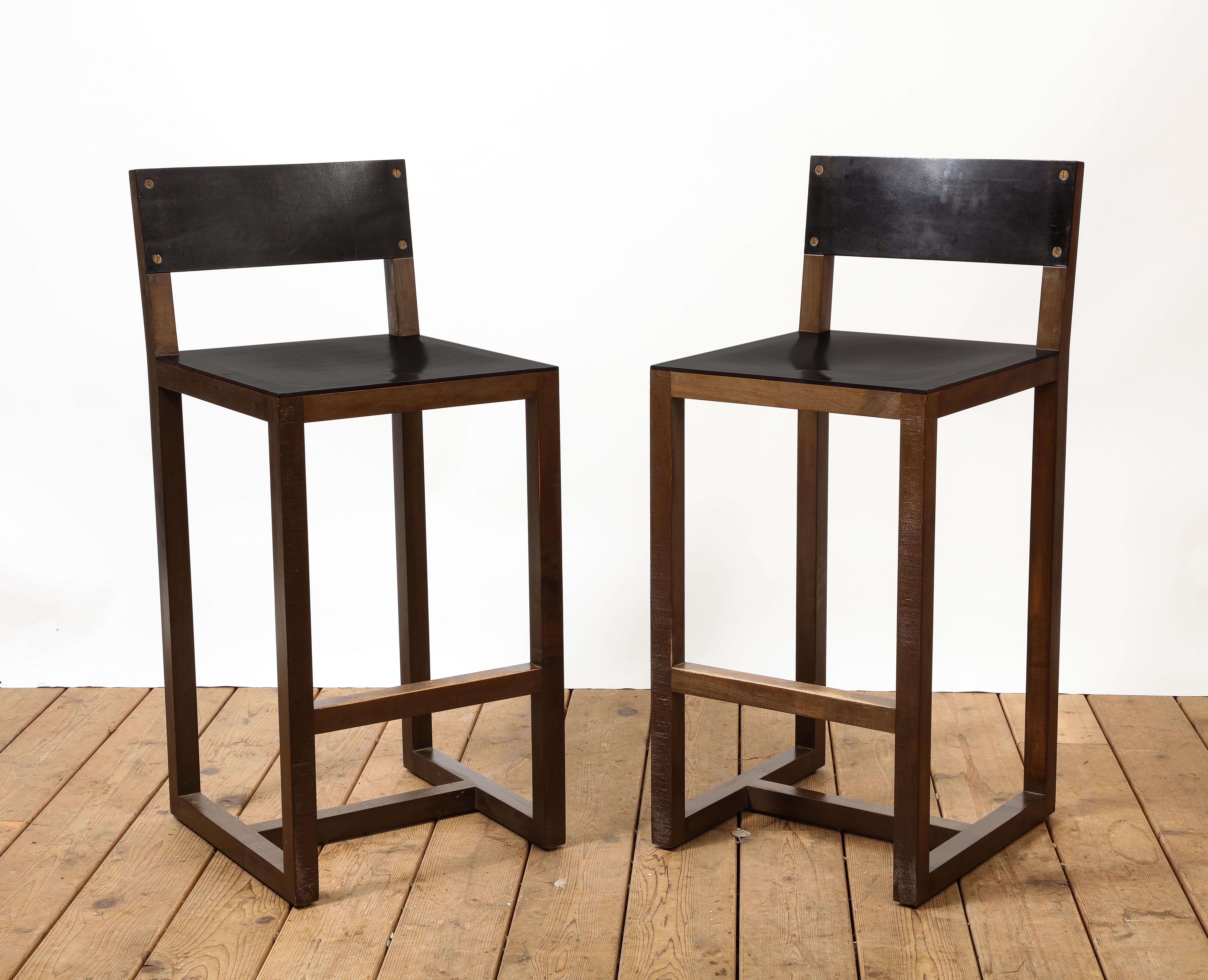 Pair of BDDW square guest counter height wood bar stools with dark brown leather seats and backs. Comfortable footrest. 