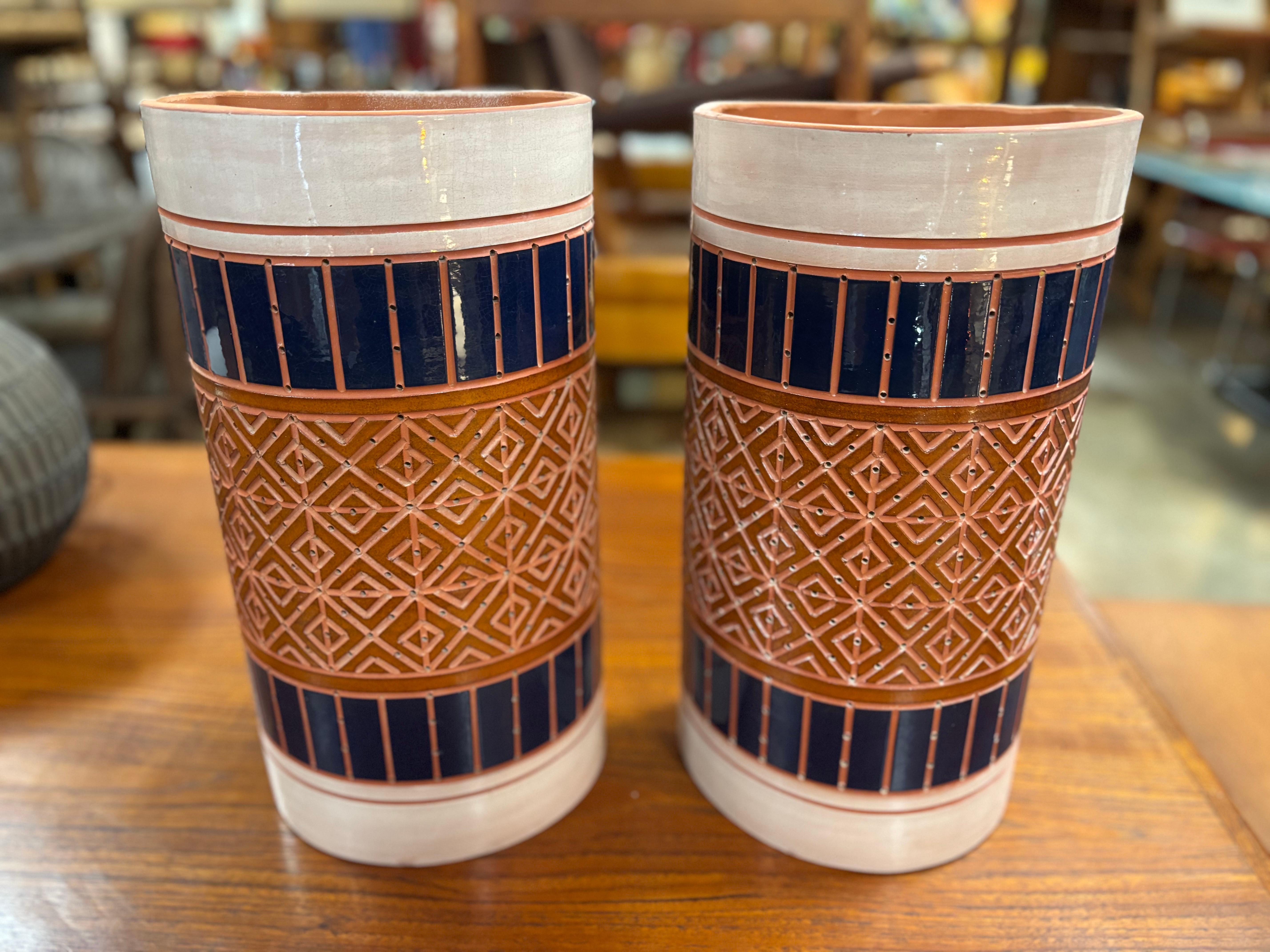 Pair of Beaumont Mood sconces, these vintage perforated ceramic light fixtures are in overall great condition, and create a beautiful warm glow. Beaumont Mood worked for the renowned Texas architect O'Neill Ford, and created many pierced ceramic