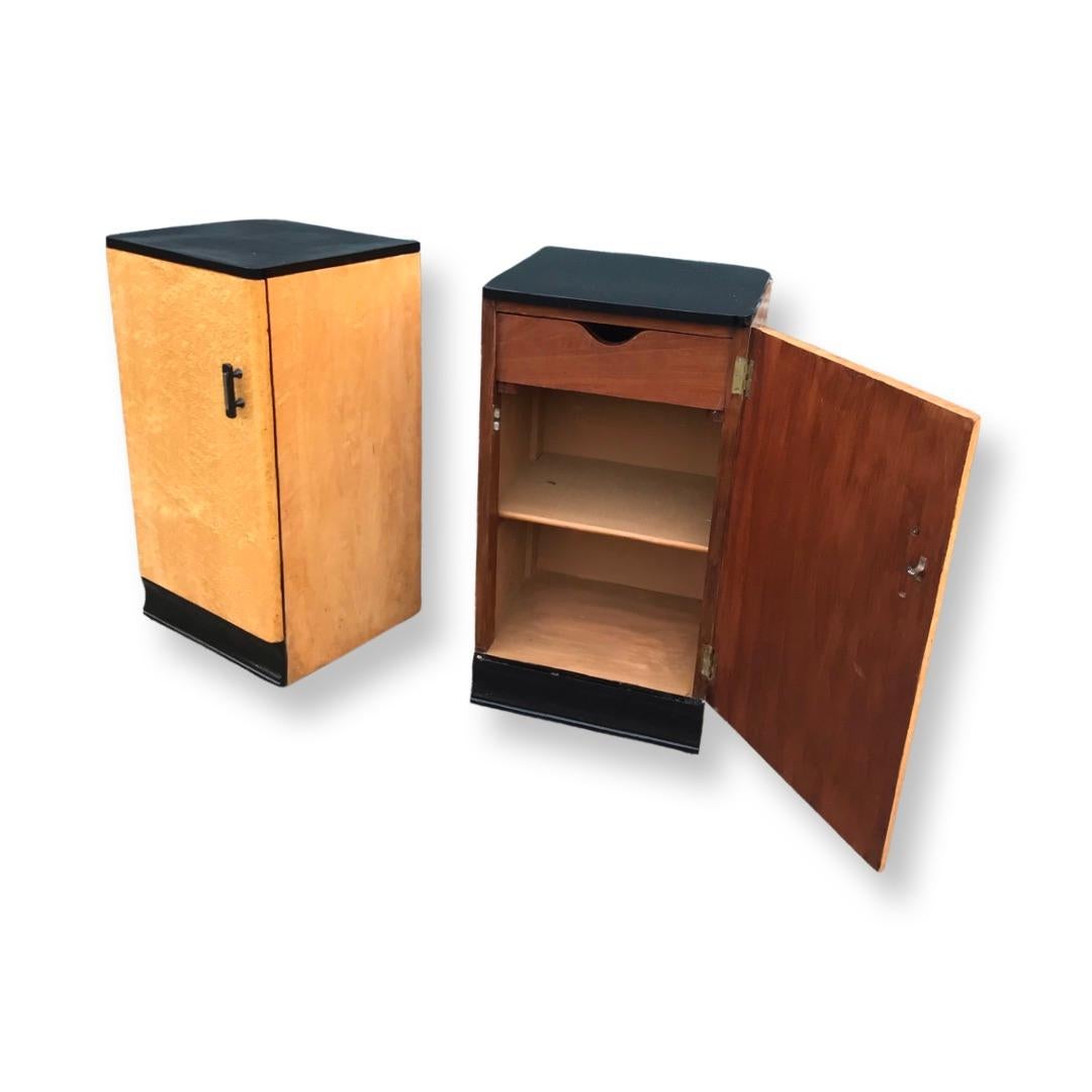 A truly stuuning pair of Birds Eye Maple matching bedside cabinets/nightstands, a gorgeous honey colour tone with striking ebonised plynth and tops. The handles are chrome with black outline and in excellent condition. The doors open to reveal a