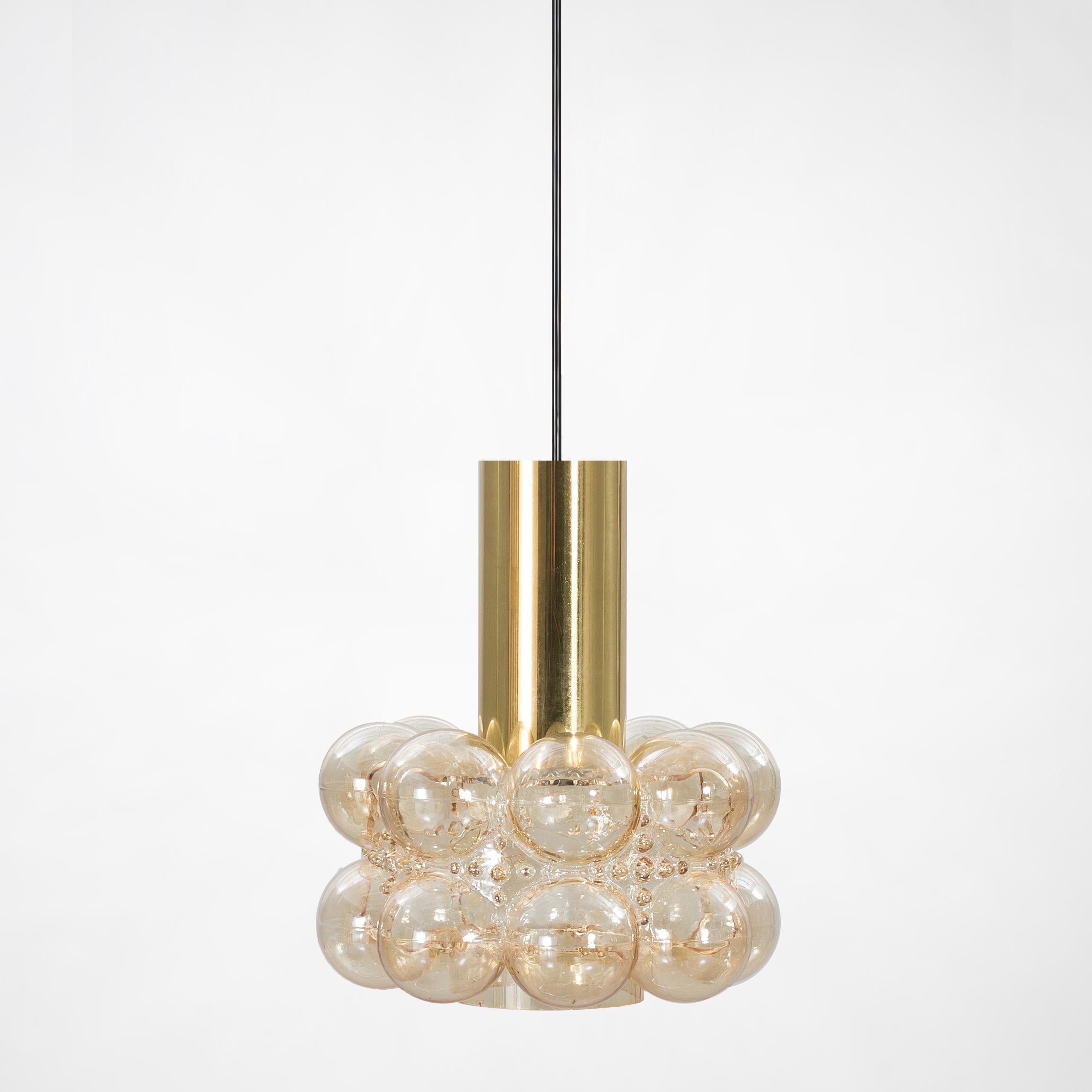 Pair of beautiful bubble glass chandeliers or pendant lights designed by Helena Tynell for Glashütte Limburg. A design Classic, the hand blown glass gives a wonderful warm glow.

The dimensions: Height 80 cm from ceiling, the diameter 30 cm.