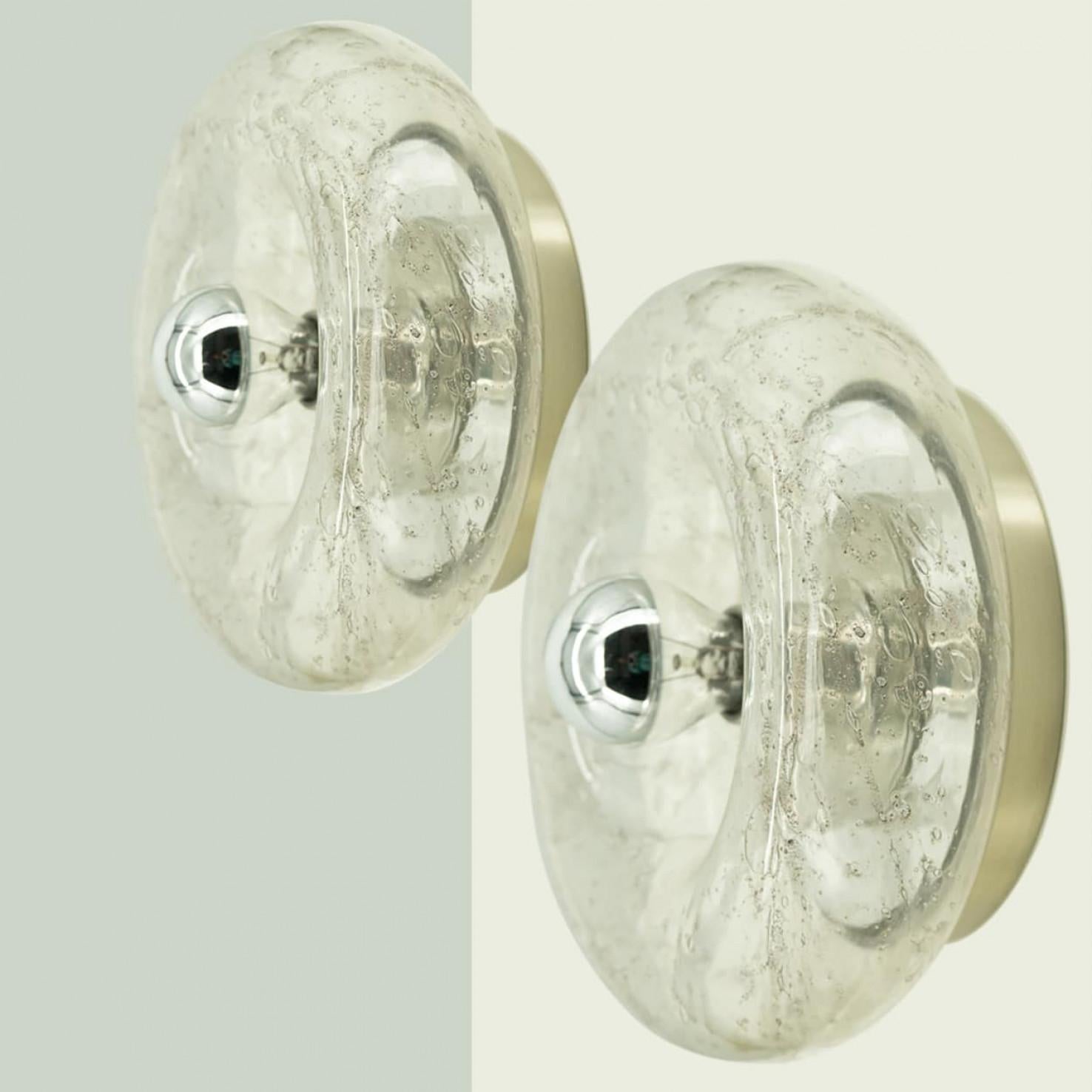 Beautiful donut glass wall light/flush mount by Doria Leuchten, Germany 1970s. The glass is mounted on a chrome back plate.

Can be used as a wall light or flush mount.

Please notice the price is for the pair.

Dimensions:
Diameter: 11.02″ (28
