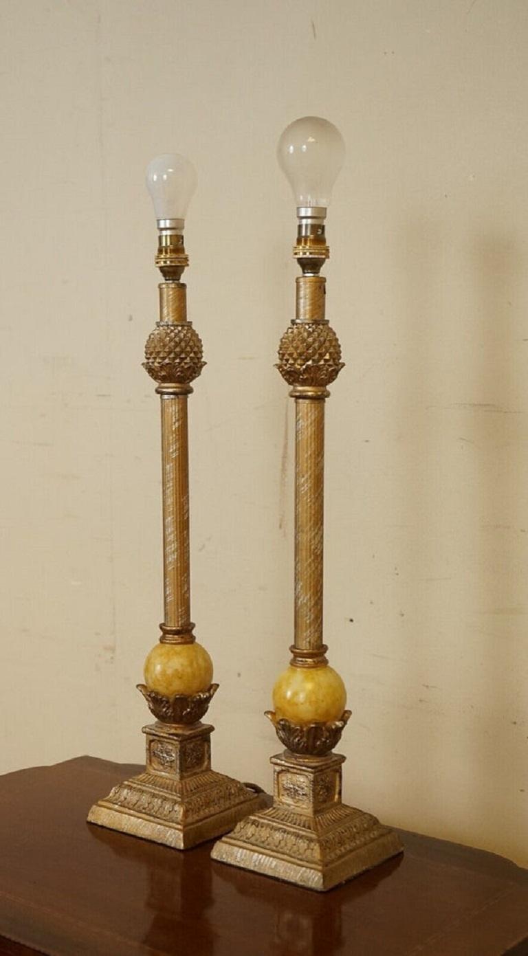 We are delighted to offer for sale this beautiful vintage pair of table lamps.

A well-made and decorative piece, it has a beautiful marble look ball sitting on the base and the rest has a lovely gold brass effect all over. The lightbulb is not