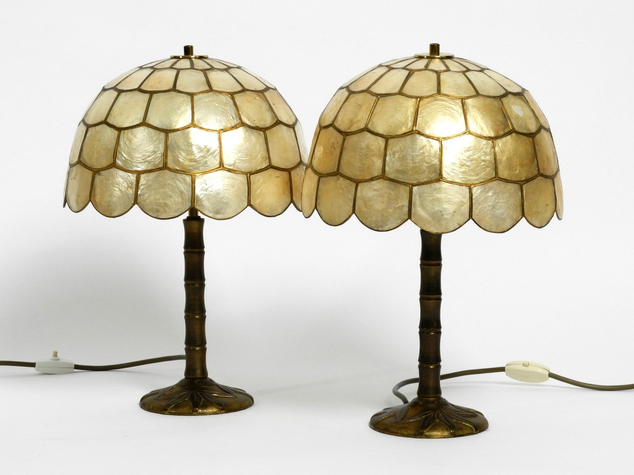 Pair of stunning beautiful large 1960s brass table lamps with mother of pearl shades.
Great rare floral design from the 1960s. Brass frame looks like a bamboo plant.
Very high quality workmanship and few signs of use. 
Both shades are made of