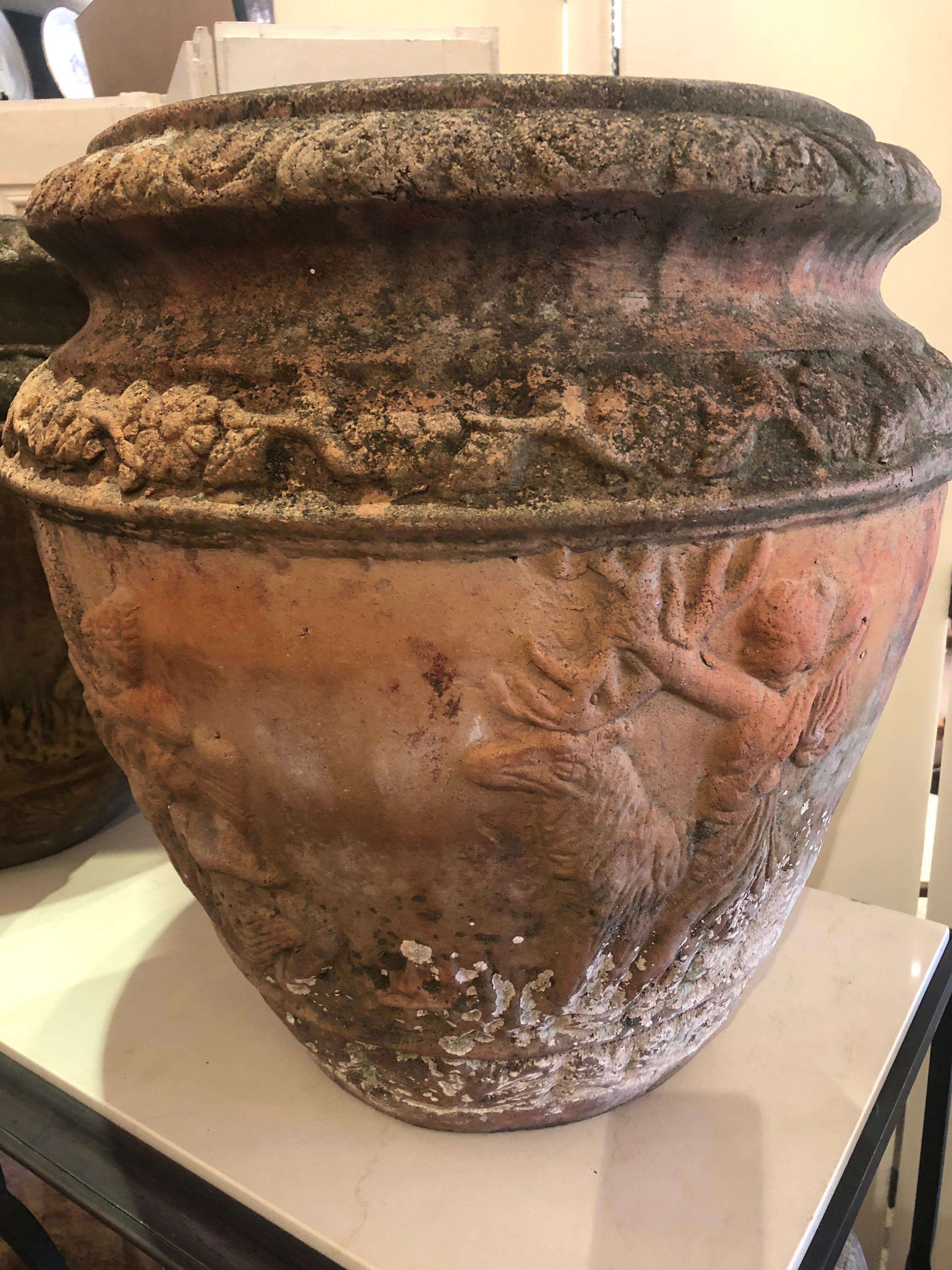 A particularly beautiful large pair of French terracotta garden urn jardinaires having lovely neoclassical relief decoration and yummy aged patina. Beautiful enough to be displayed indoors as well as in the garden.
JG.
