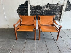 Pair of Beautiful mid century tan Cognac leather safari sling lounge chairs