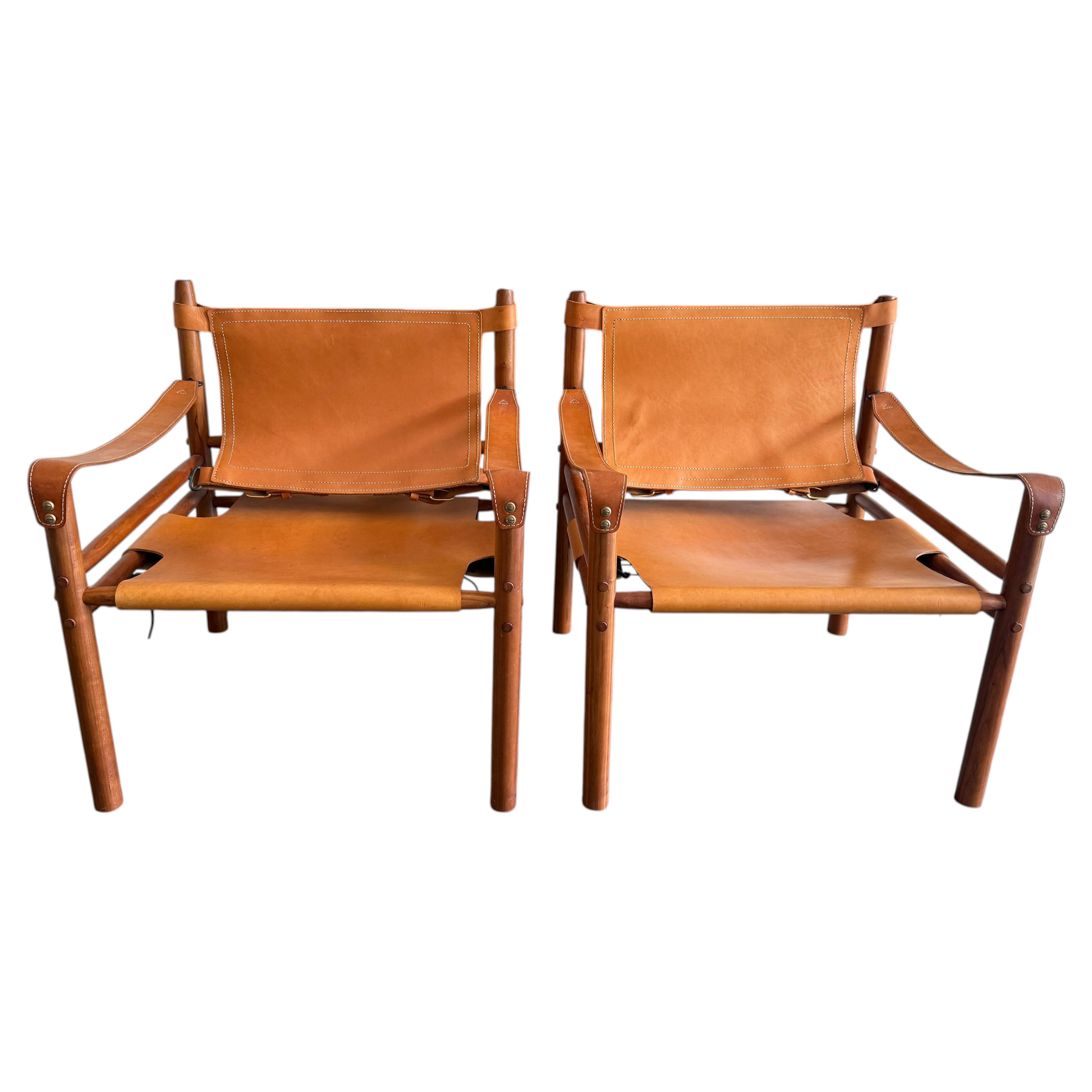 Pair of Beautiful mid century tan Cognac leather safari sling lounge chairs