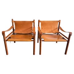 Pair of Beautiful mid century tan Cognac leather safari sling lounge chairs