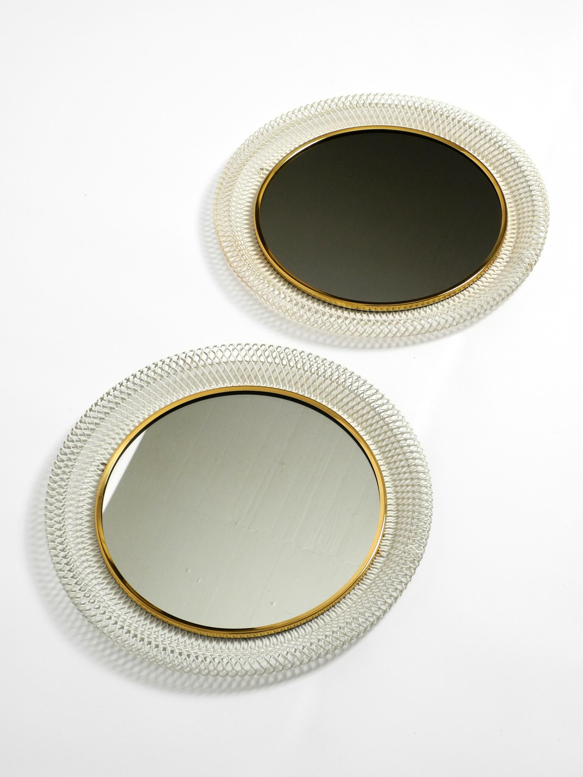 Mid-20th Century Pair of beautiful Mid Century wall mirrors with brass rim and white metal frames For Sale
