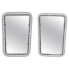 Pair of beautiful small original Mid Century Modern black metal wall mirrors