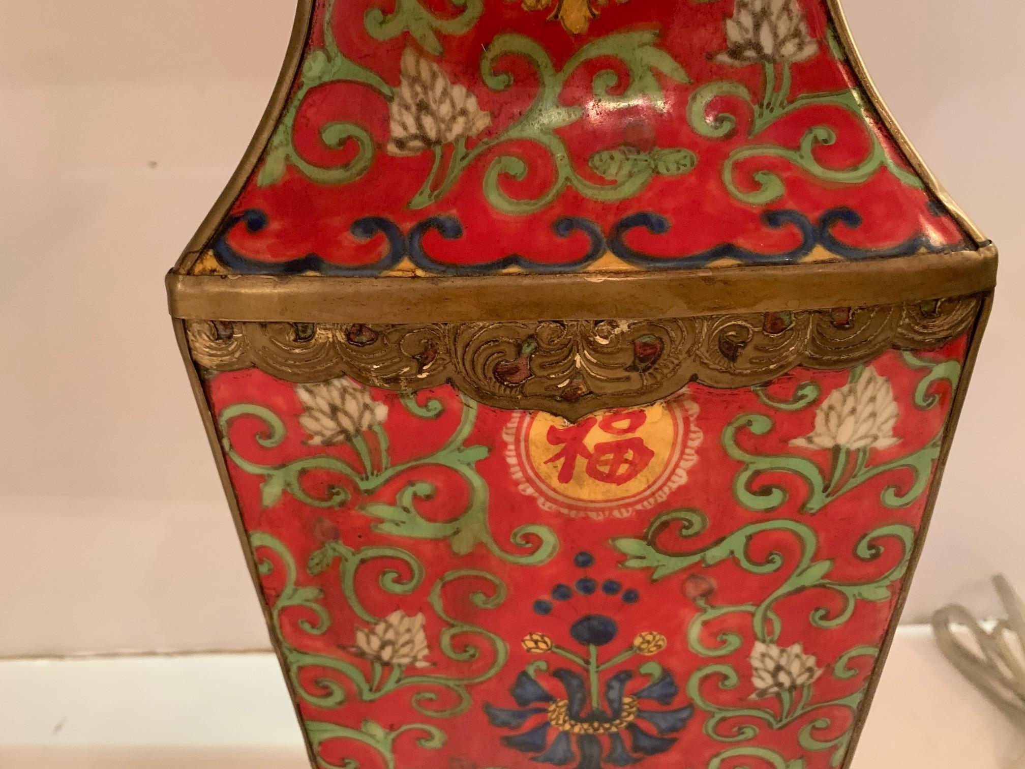 A gorgeous pair of Chinese red table lamps having meticulous decorative pattern of contrasting green curlicue floral motif including navy blue, yellow and cream embellishments.
Custom silk shade with Asian brass finial.
Base 6.25” square
Shade
