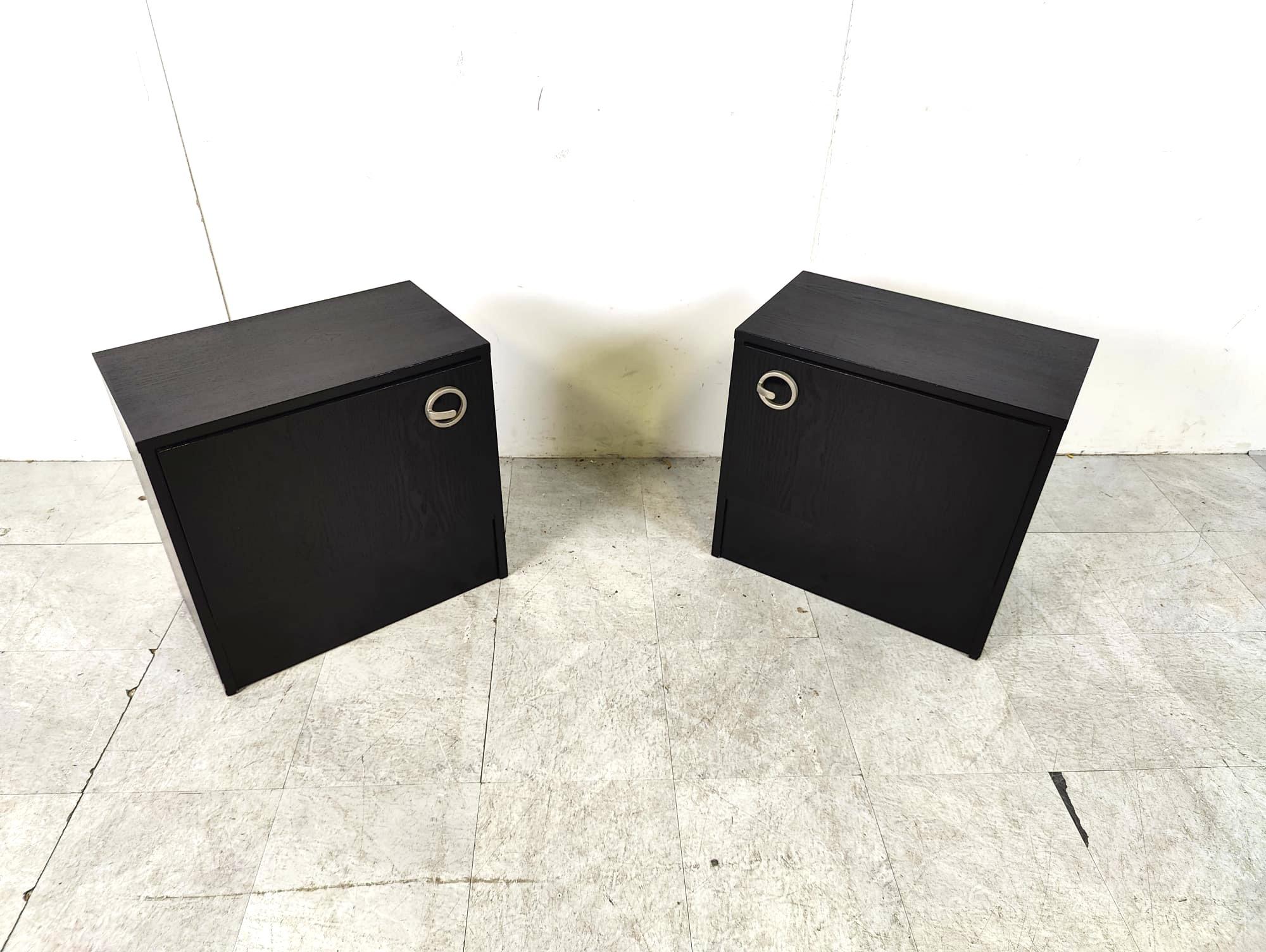 Pair of black wooden seventies bedside cabinets.

The cabinets have cool handles. 

1970s - Belgium

Good condition

Dimensions:
Height: 53cm
Width: 55cm
Depth: 33cm

Ref.: 6425151