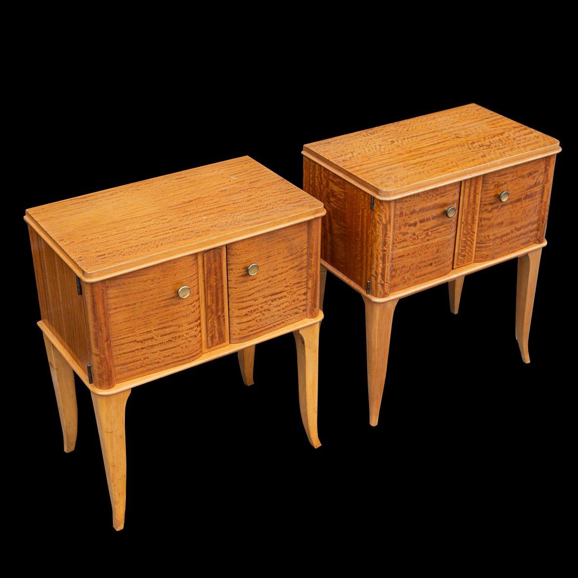 Elegant Deco beautifully made matching Satin birch (lemon wood) cabinets with stunning patina. Original quality brass handles and opening via two hinged doors with a typical Pascaud form standing on sabre legs. Excellent joinery and of solid