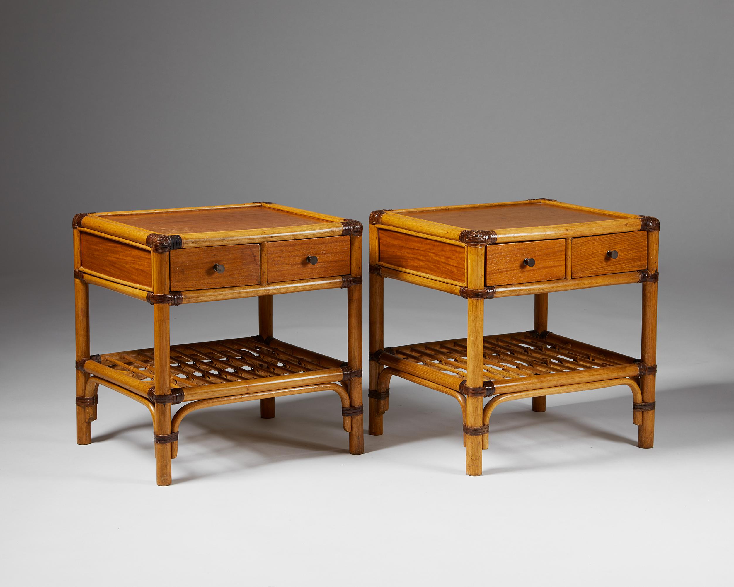 Pair of bedside tables, anonymous for DUX,
Sweden. 1960s.

Bamboo, rattan, cane, wood.

The colonial-style combination of bamboo, stained rattan, cane, and wood makes this Scandinavian bedside table design particularly interesting. The darker woven