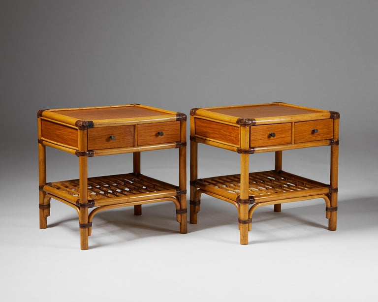Pair of bedside tables, anonymous for DUX, Sweden. 1960s.

Bamboo, rattan, cane, and wood.

The colonial-style combination of bamboo, stained rattan, cane, and wood makes this Scandinavian bedside table design particularly interesting. The darker