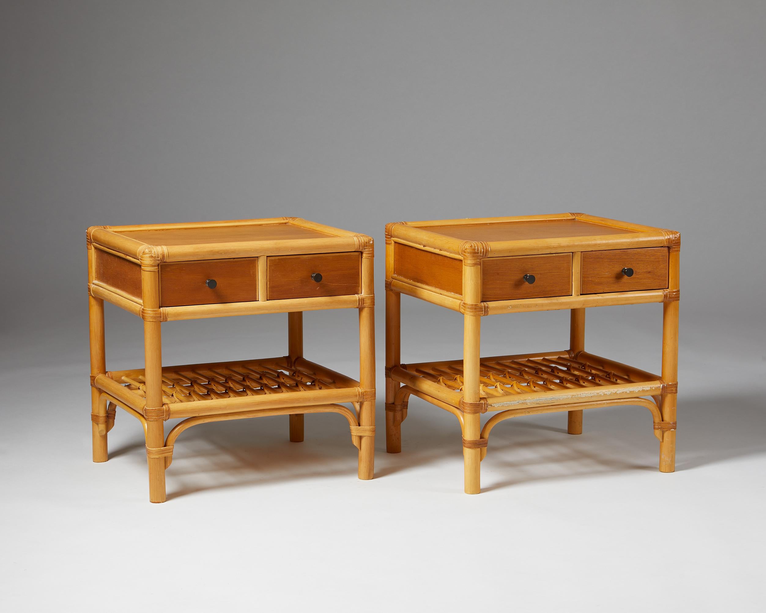 Pair of bedside tables, anonymous for DUX,
Sweden. 1960s.

Cane, rattan and teak.

The colonial-style combination of cane, rattan, and teak makes this Scandinavian bedside table design particularly interesting. The woven edges and metal handles