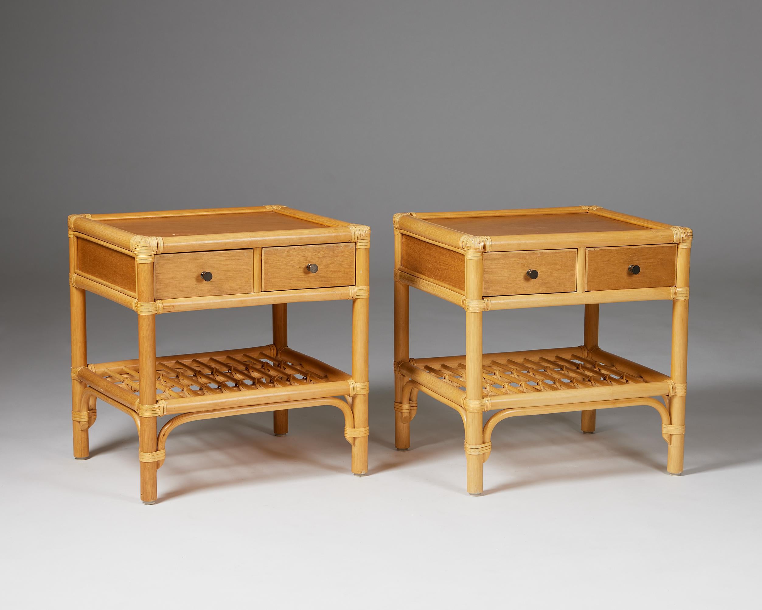 Pair of bedside tables, anonymous for DUX,
Sweden, 1960s.

Cane, rattan, teak and metal.

The colonial-style combination of cane, rattan, and teak makes this Scandinavian bedside table design particularly interesting. The woven edges and metal