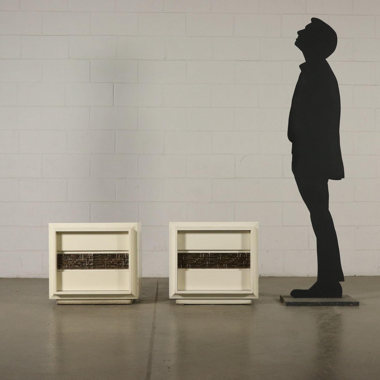 A pair of bedside tables designed by Luciano Frigerio (1928-1999) for Frigerio. Lacquered wood, brass sheet. Manufactured in Italy, 1960s-1970s.