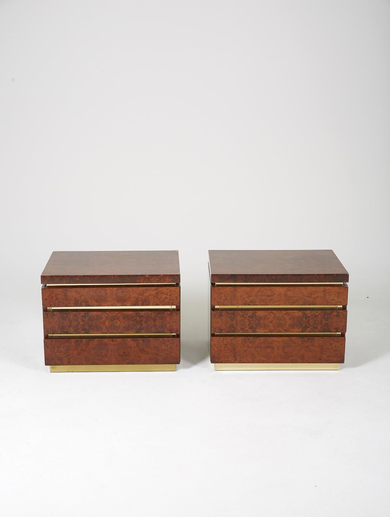 Pair of bedside tables by Jean Claude Mahey in burr elm and brass from the 70s. Each composed of 3 drawers. Very nice aspect of the wood highlighted by the brass angles. Good condition with some traces of use. French work label present on the back