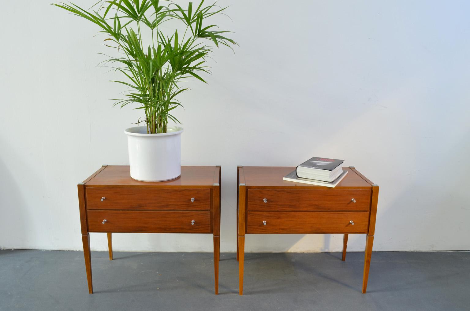 These 2 bedside tables or nightstands from the 1960s are made of red - brown cherrywood, 1960s France. The surface shows light scratches and fading, see photo.