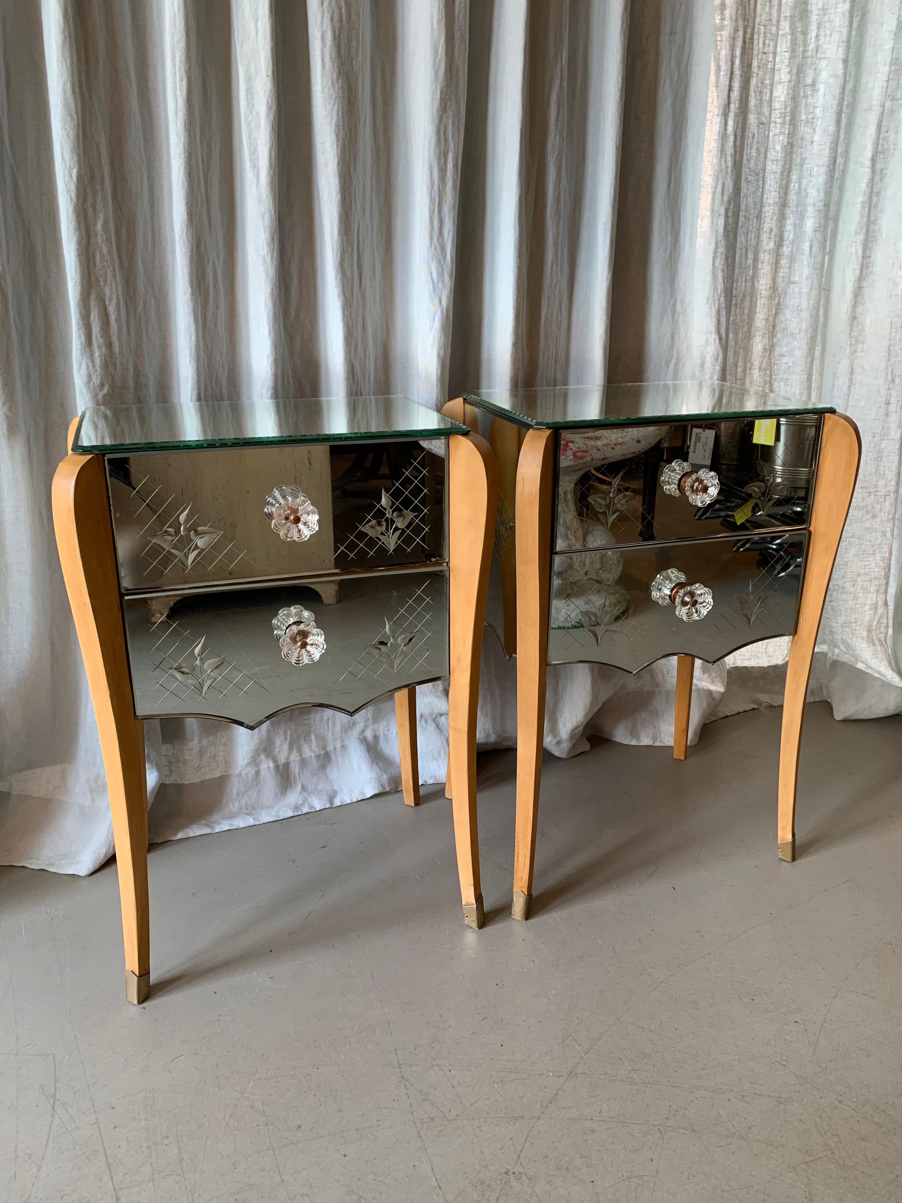 Gorgeous pair of French Venetian Style 1930s bed side tables with floral engraved and cut decoration in the mirror glass. The set has patina, especially on one table top - but both tables are in good condition with no nicks or cuts.