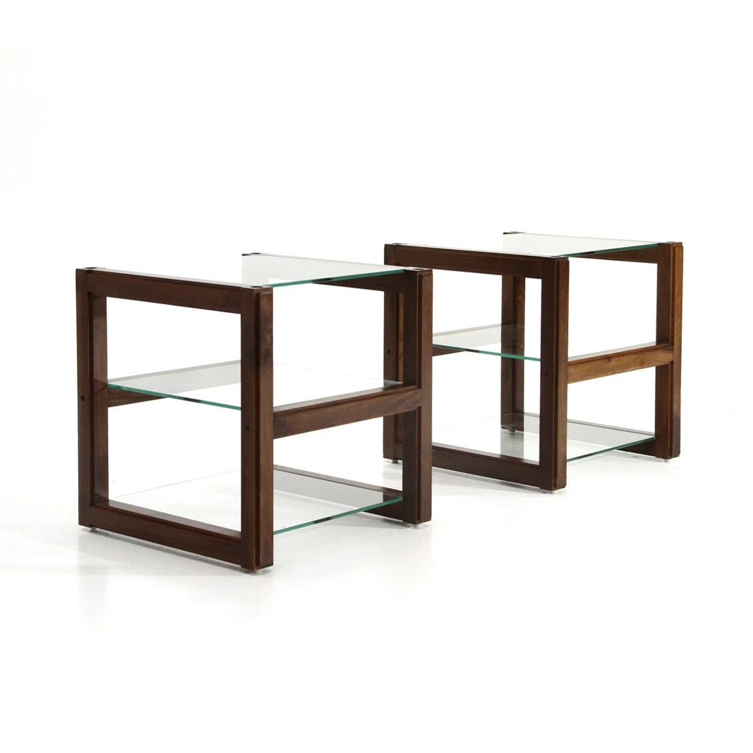 Pair of Italian-made bedside tables produced in the 1960s.
Wooden structure.
3 glass shelves.
Plastic feet.
The bedside tables can be stacked to become a small bookcase.
Good general condition, some signs due to normal use over