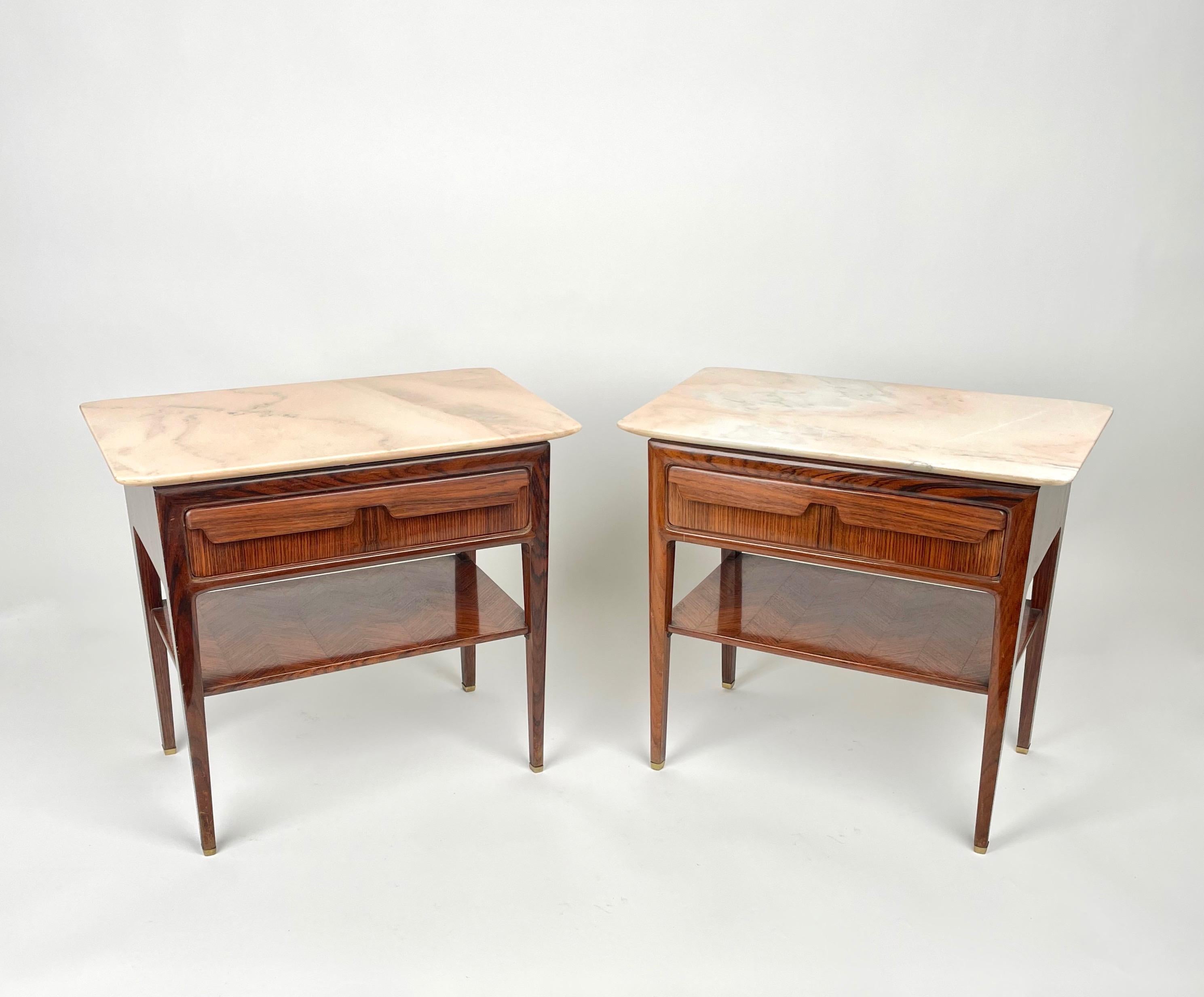 Pair of bedside tables in wood structure featuring one drawer each, a marble surface and a lower wood shelf by the Italian designer Vittorio Dassi. 

Made in Italy in the 1950s.