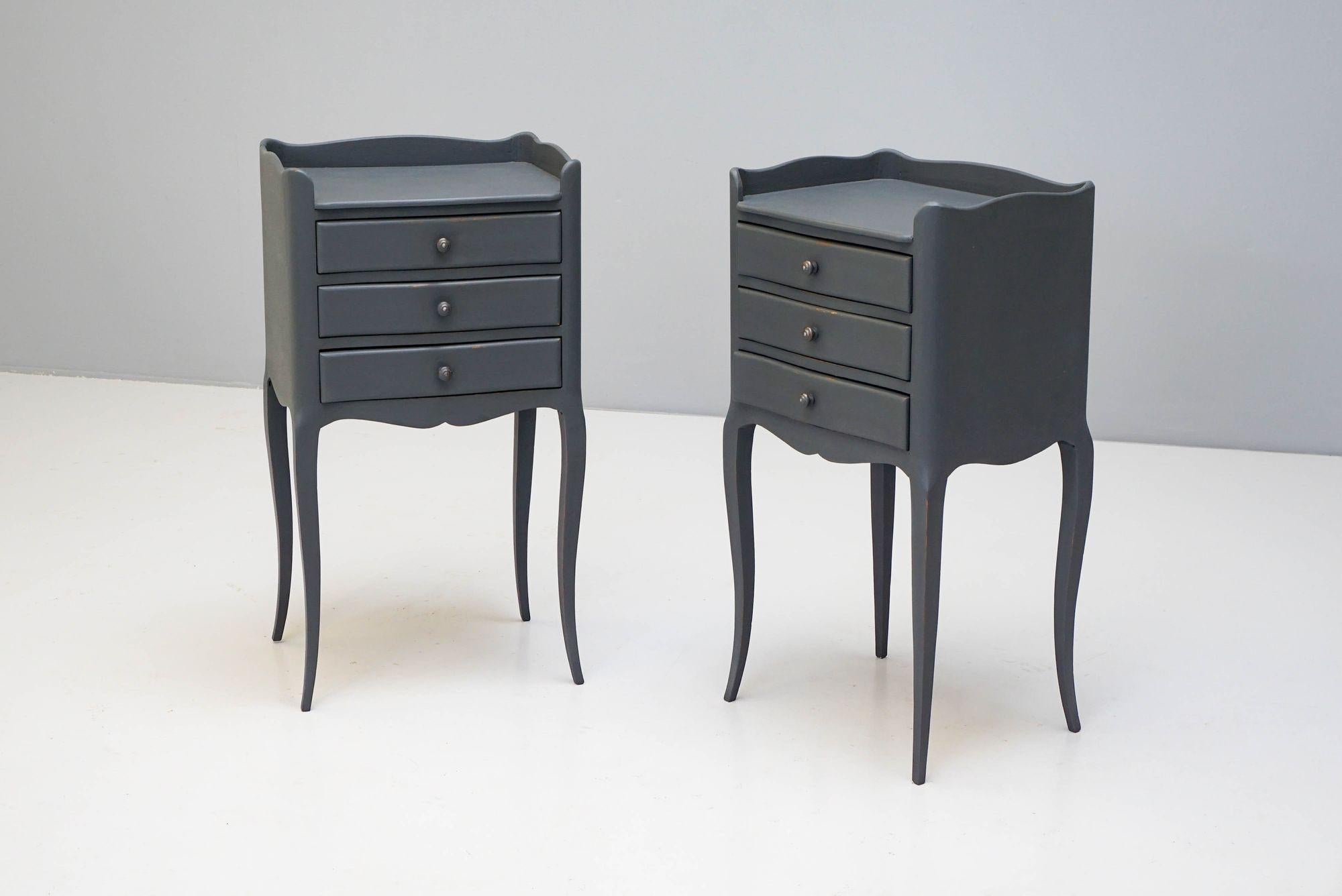 Pair of French bedside chest of drawers on cabriole legs in later painted grey finish.