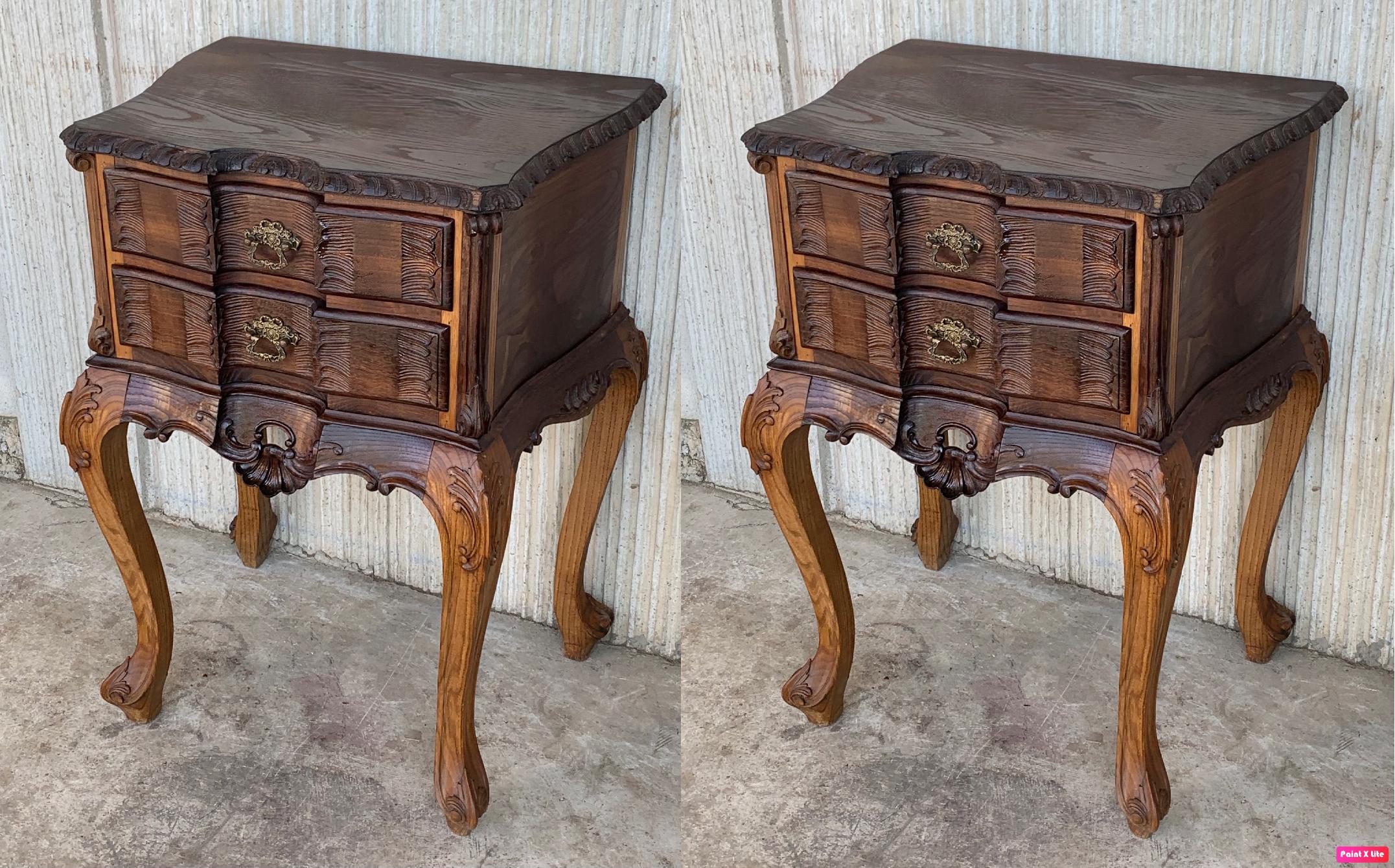 A French chestnut two-drawer commode from the late-19th century with ribbon-carved moldings and carved skirt. This petite French commode features a rectangular top with beveled edges, sitting above two exquisite drawers, each simply adorned with a