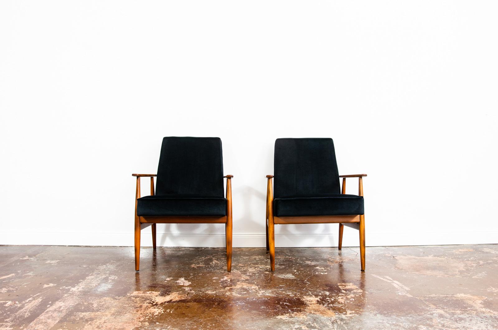 Pair of mid-century armchairs, type 300-190 designed by H. Lis, manufactured in Poland, 1960's.
Reupholstered in black soft fabric. 
Solid wood frames have been completely restored and refinished.