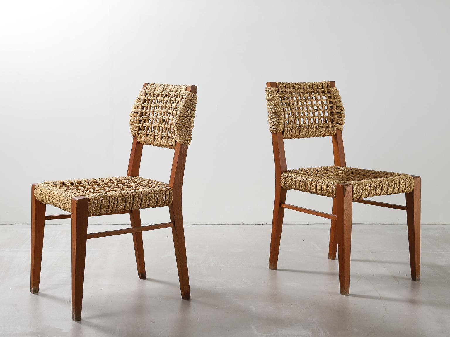 Pair of beech and woven rope dining chairs by Adrien Audoux and Frida Minet. 1950s

A French couple, Adrien Audoux and Frida Minet, where designers in the 1940s and 1950s. They mainly designed using the combination of wood and rope.