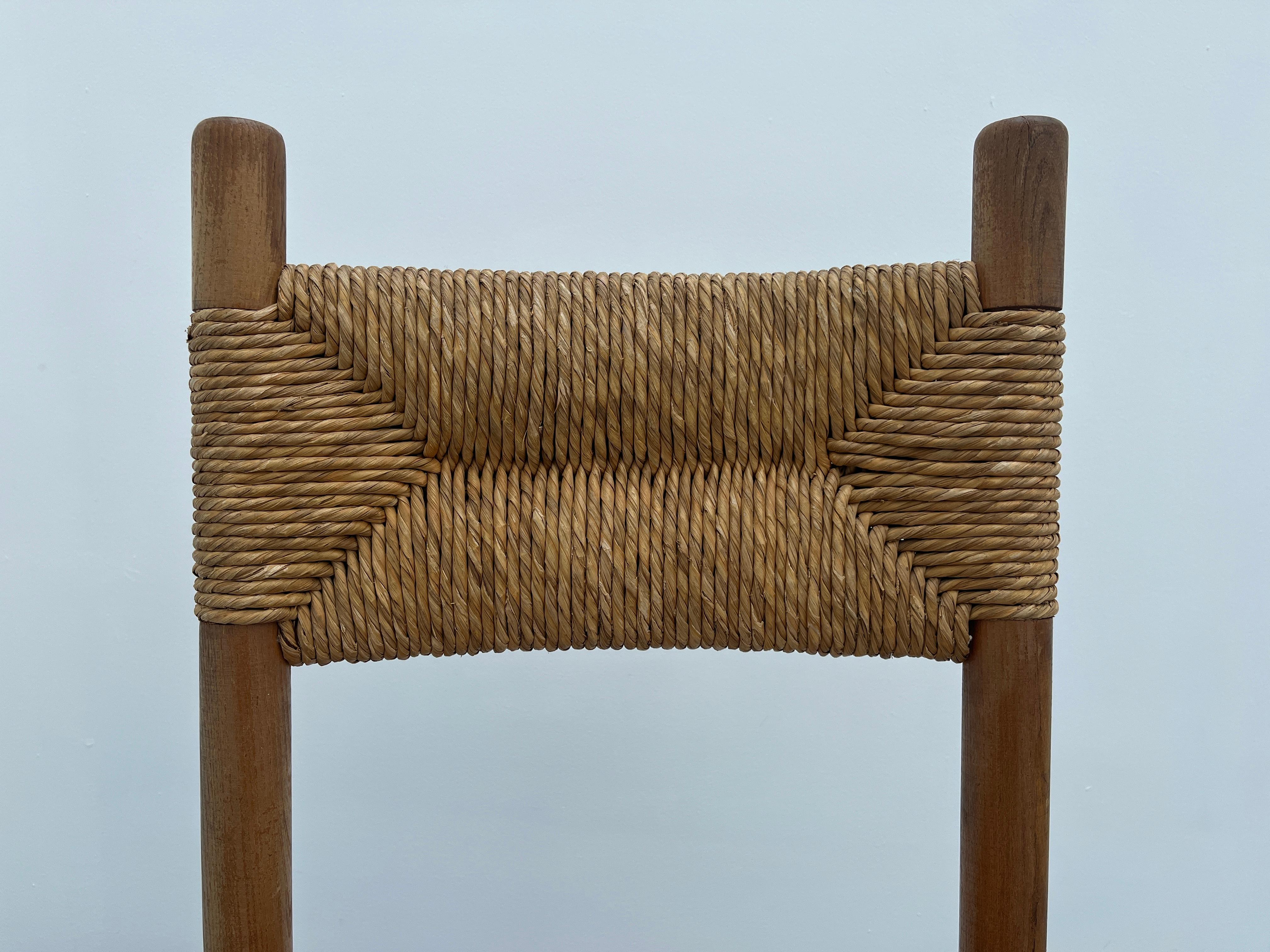 French Pair of beechwood chairs with straw seat in the style of Charlotte Perriand For Sale