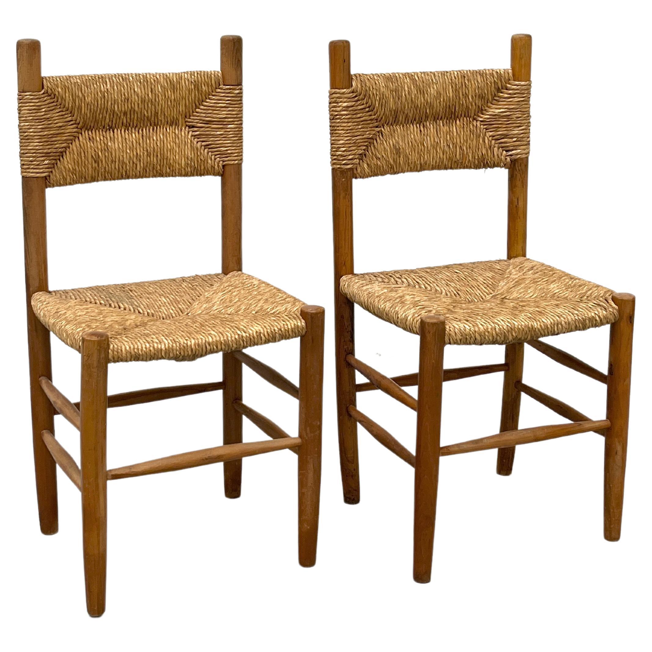 Pair of beechwood chairs with straw seat in the style of Charlotte Perriand