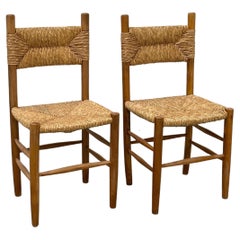 Pair of beechwood chairs with straw seat in the style of Charlotte Perriand