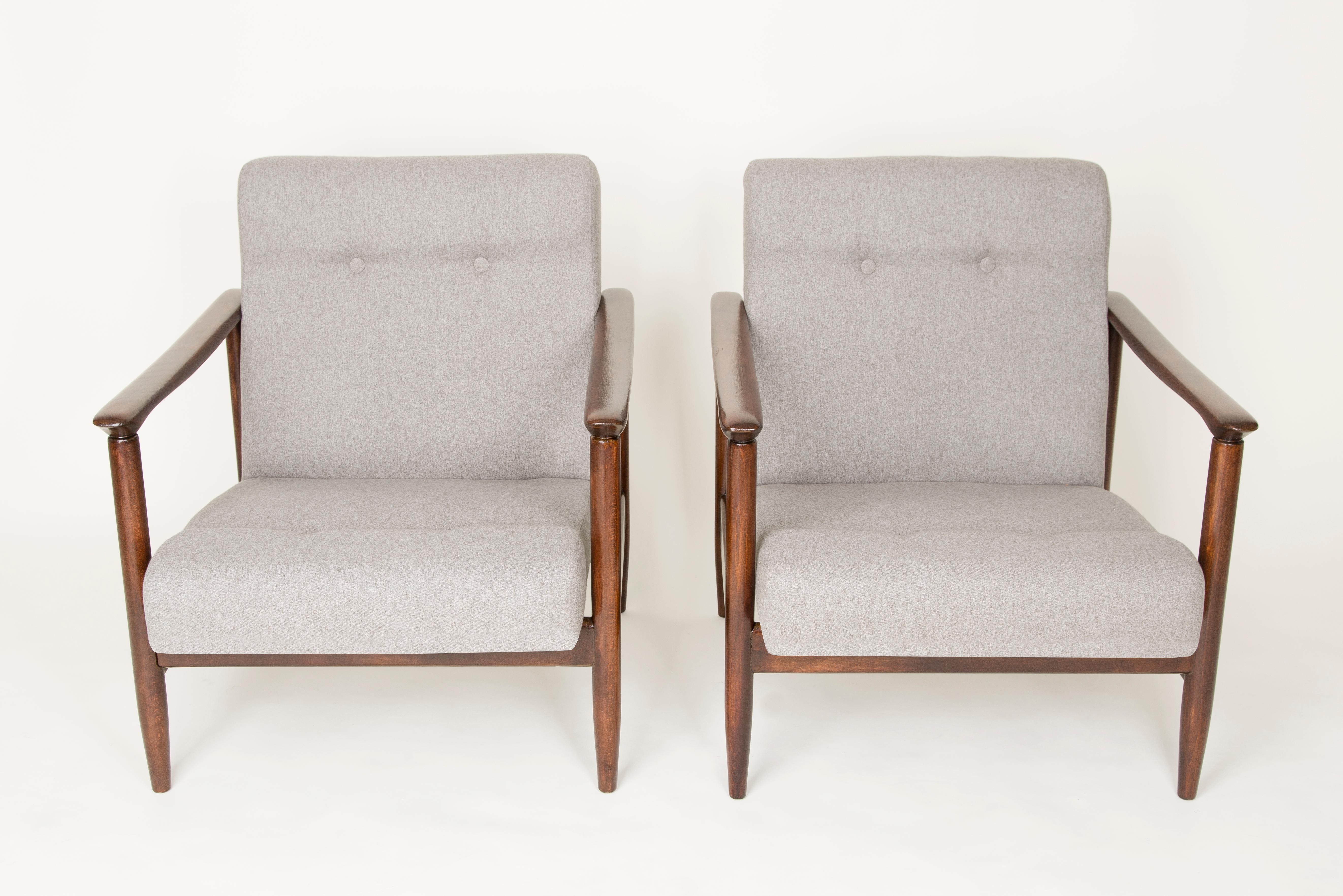 A pair of armchairs GFM-142, designed by Edmund Homa. The armchairs were made in the 1960s in the Gosciecinska Furniture Factory. They are made from solid beechwood. The GFM-142 armchair is regarded one of the best polish armchair design from the