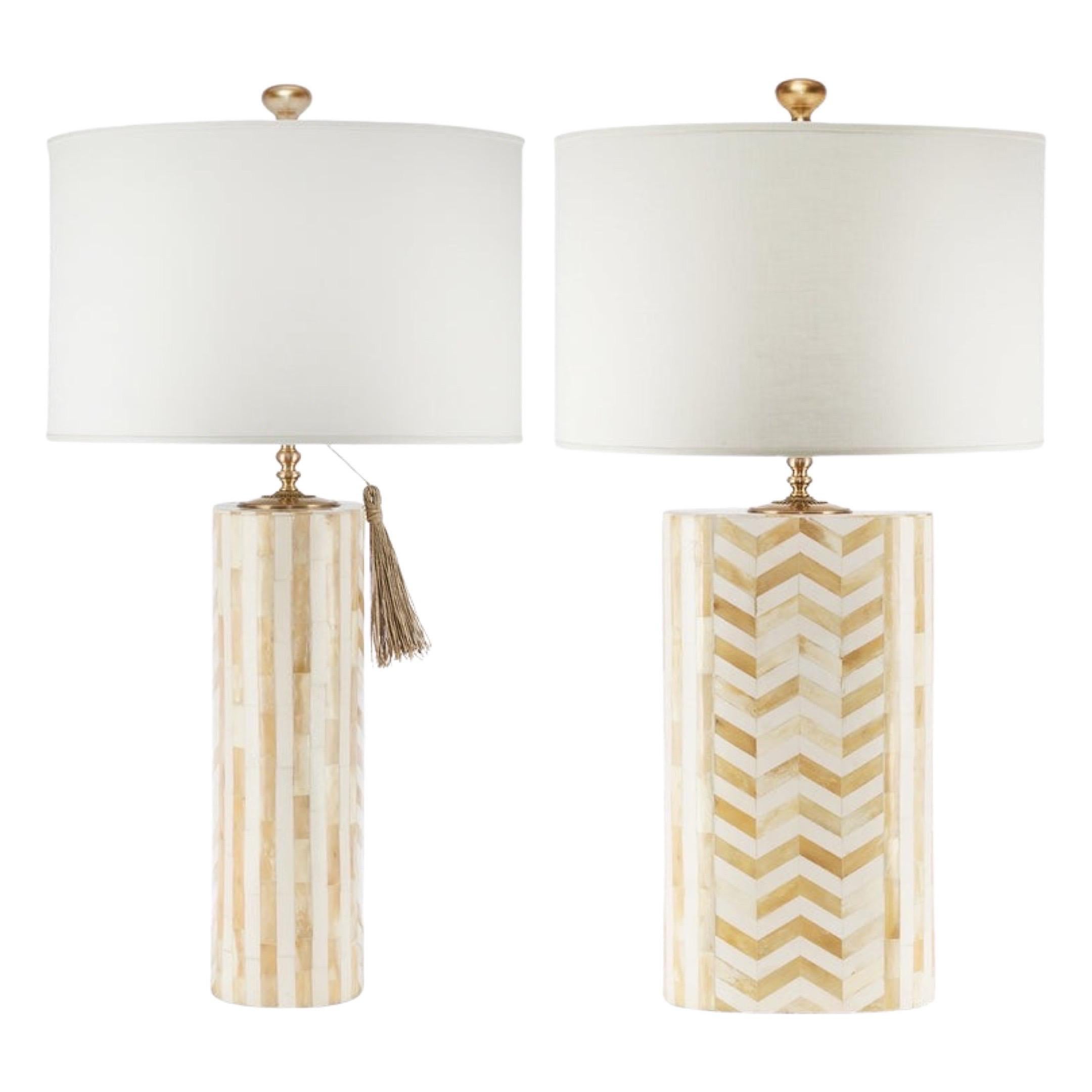A very chic and modern pair of lamps. Beautifully made in tessellated bone in a mix of herringbone pattern and vertical columns. The gold details on the rosette and tap sculpted finalists make them so chic… even for the most discriminating taste
