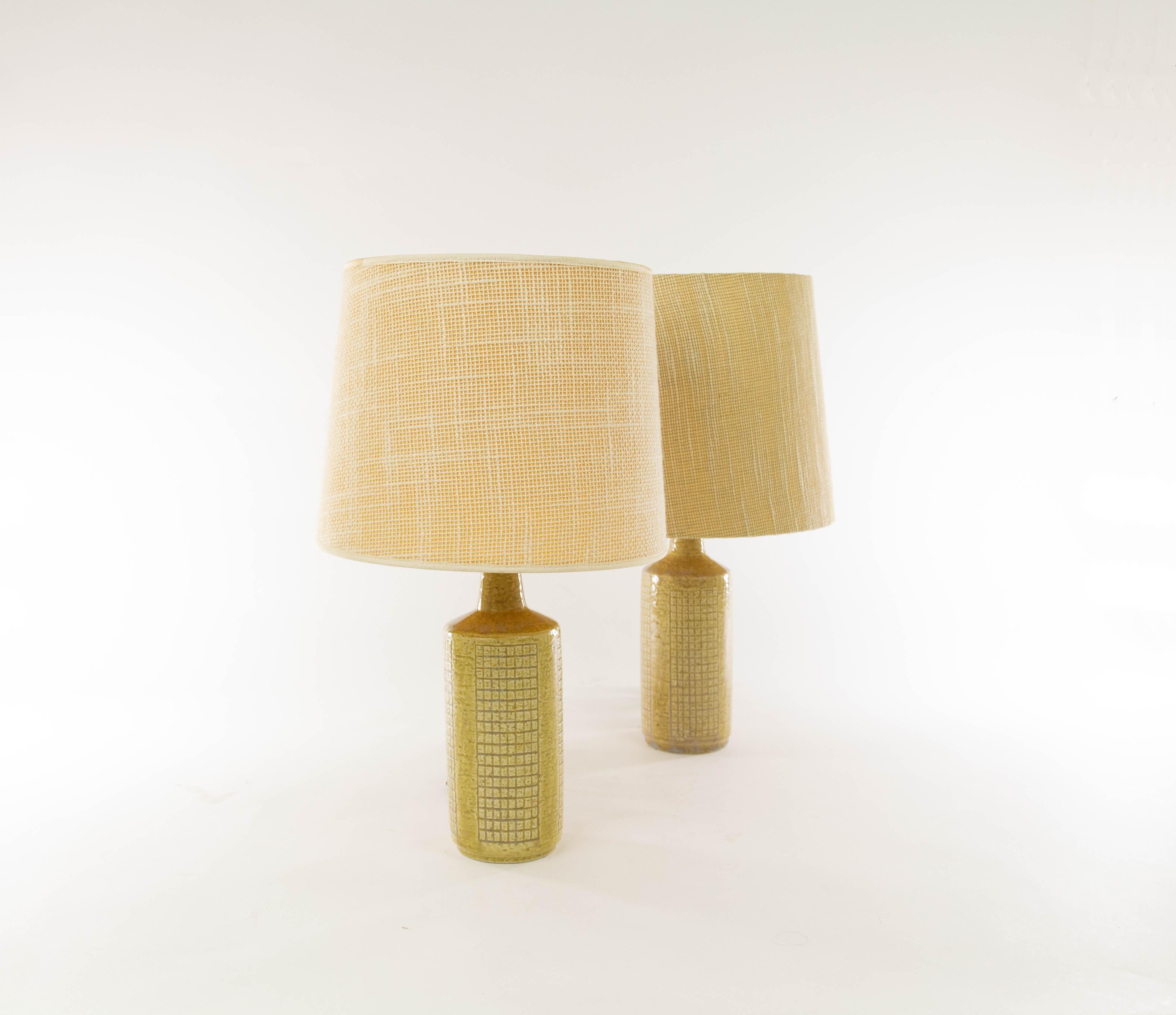 A pair of DL/30 table lamps made by Annelise and Per Linnemann-Schmidt for Palshus in the 1960s. 

The colour of both pieces is beige or 'grain'. Although both pieces are very similar, they are not exactly the same. There may be small differences in
