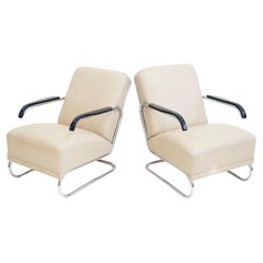 Pareja de tumbonas de cuero beige y acero tubular
