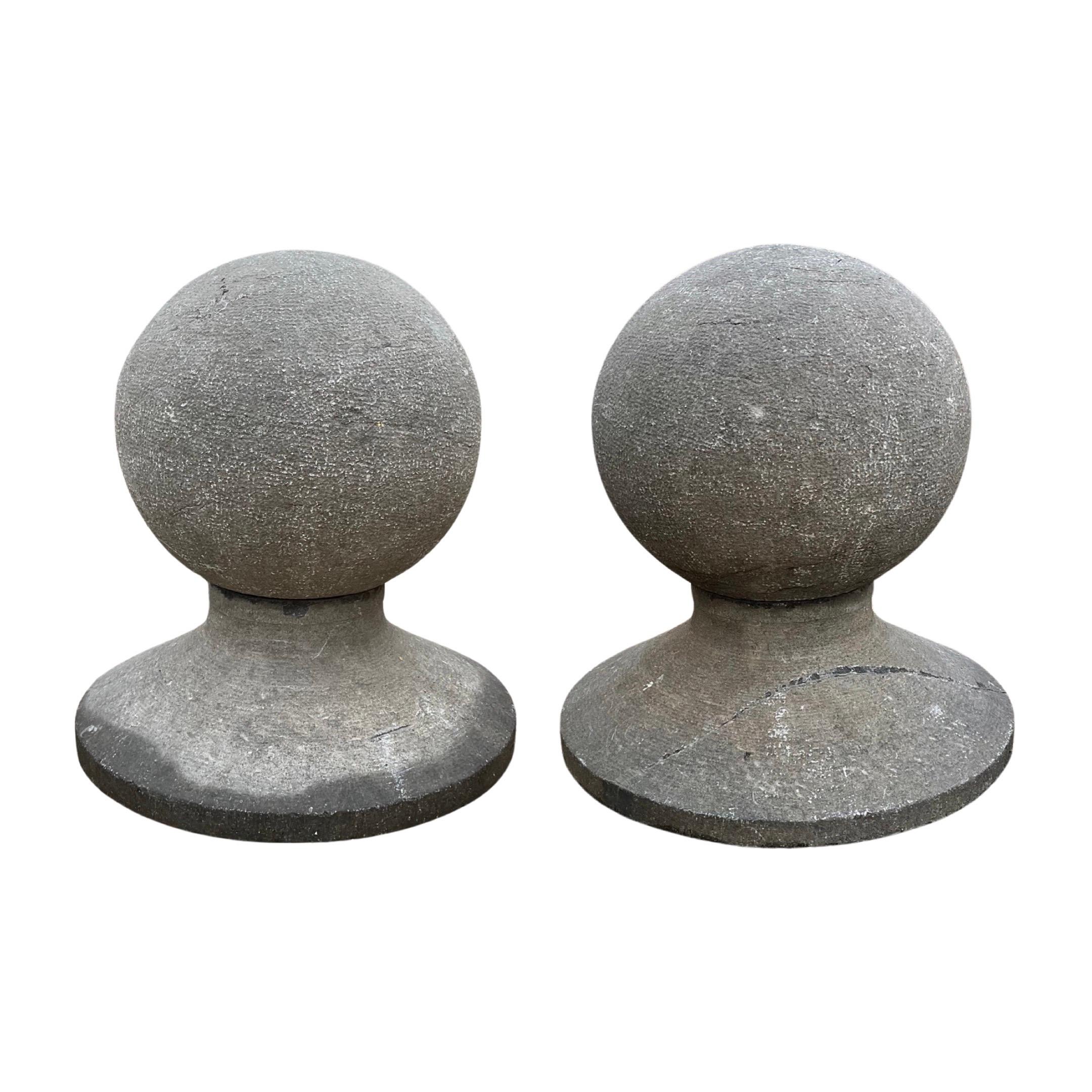 These Belgian Bluestone Circular Finials are expertly crafted from 18th century bluestone, originating from Belgium. Sold as a pair, the round circular style finials and base add a touch of elegance to any architectural design or landscaping