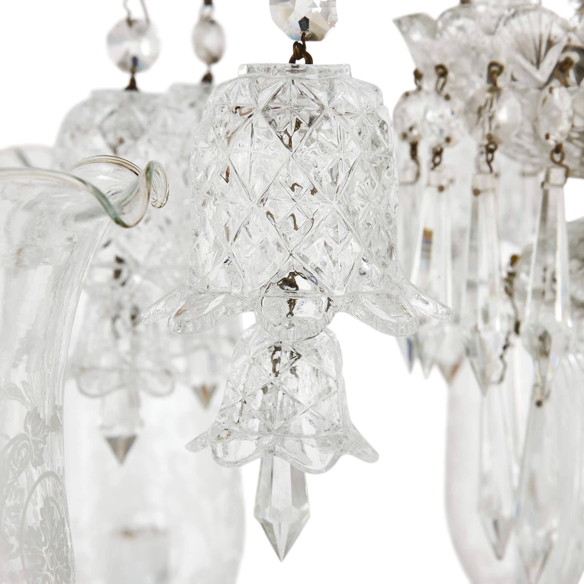 Pair of Belle Époque clear cut and etched glass 6-light chandeliers 
Continental, 20th Century 
Height 70cm, diameter 64cm

Crafted in the Belle Époque style popular in France in the late 19th and early 20th centuries, this pair of chandeliers would