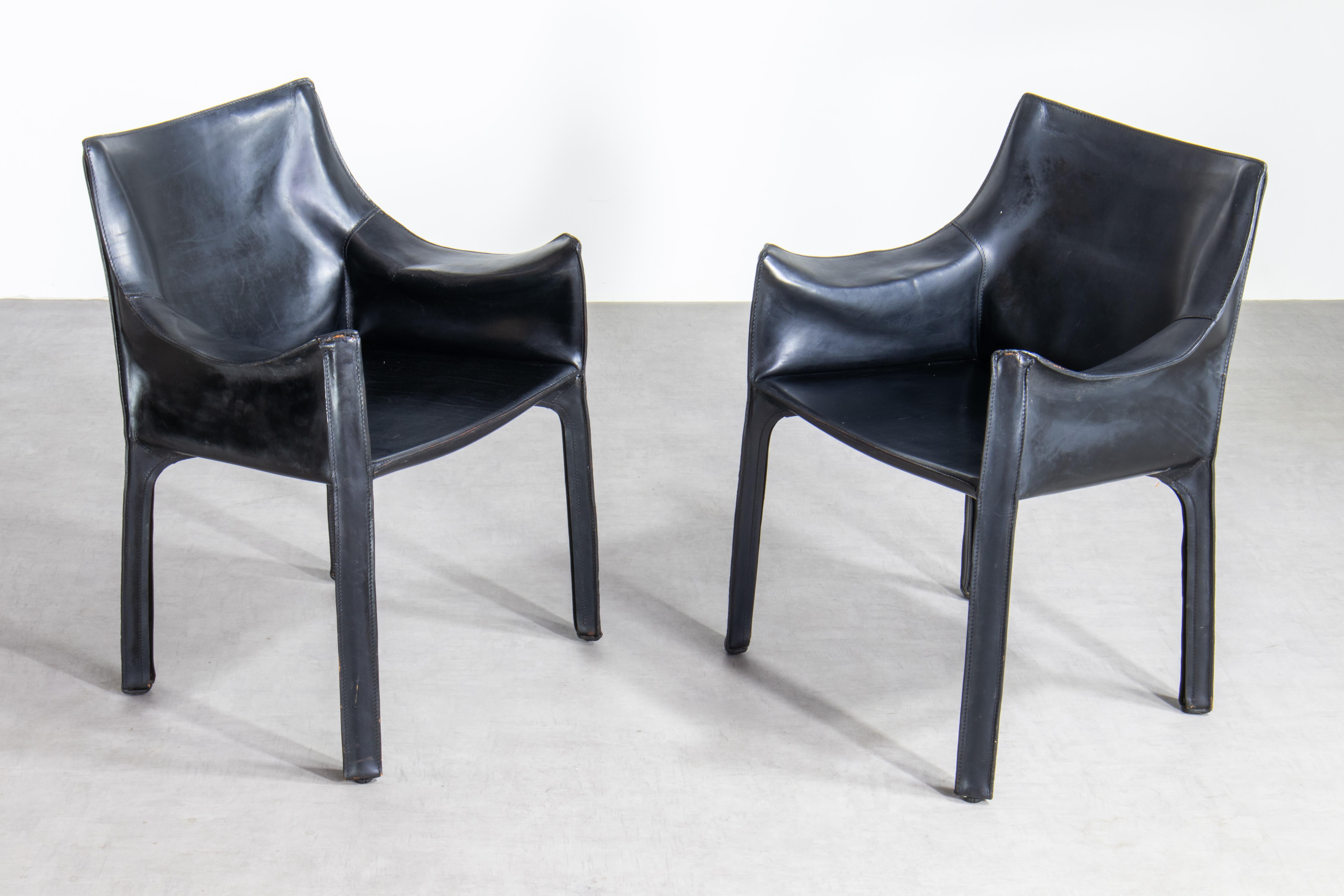 Early pair of original Mario Bellini CAB 413 chairs, a true emblem of timeless design. Manufactured by the renowned Italian design house, Cassina, in the 1970s, these chairs represent a perfect amalgamation of form and function.

Key