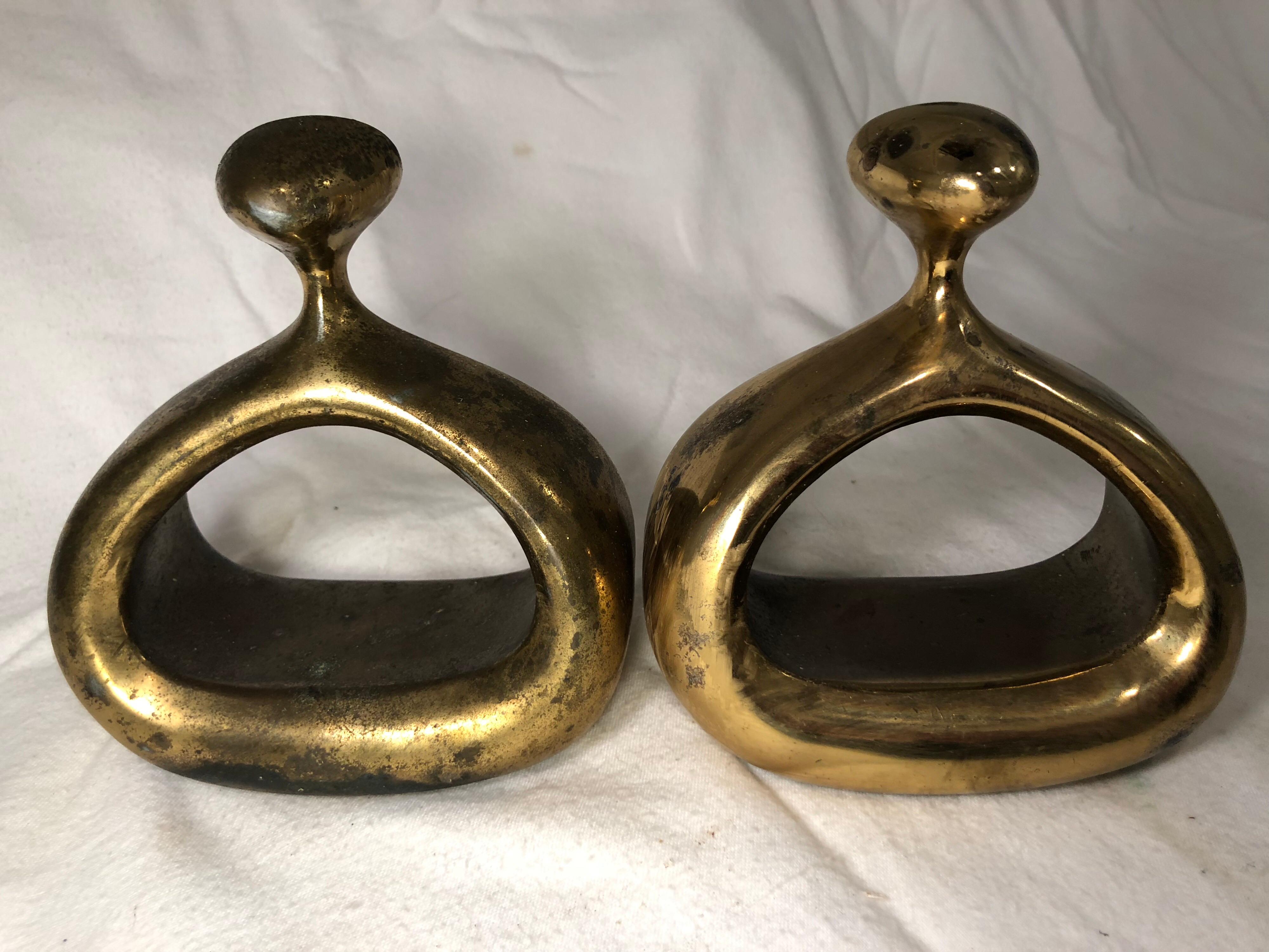 Pair of Ben Seibel Bookends for Jenfred-Ware . Amoeba like shape to these Classic midcentury bookends. These book weights are rather light. Not super heavy like other Ben Seibel ones. Unable to polish clean, 