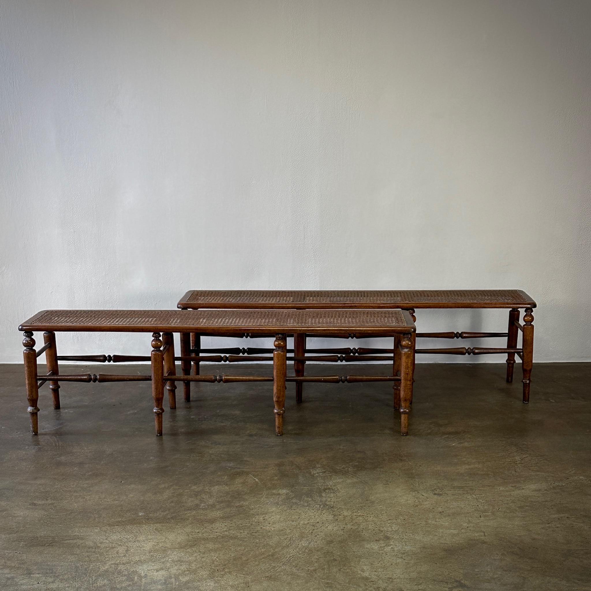 Pair of English 1860s mahogany benches with caned seats and ivory linen upholstered cushions. Would make a gracious addition to any bedroom or entry space. 

England, circa 1860

Dimensions: 60W x 12D x 17.5H
