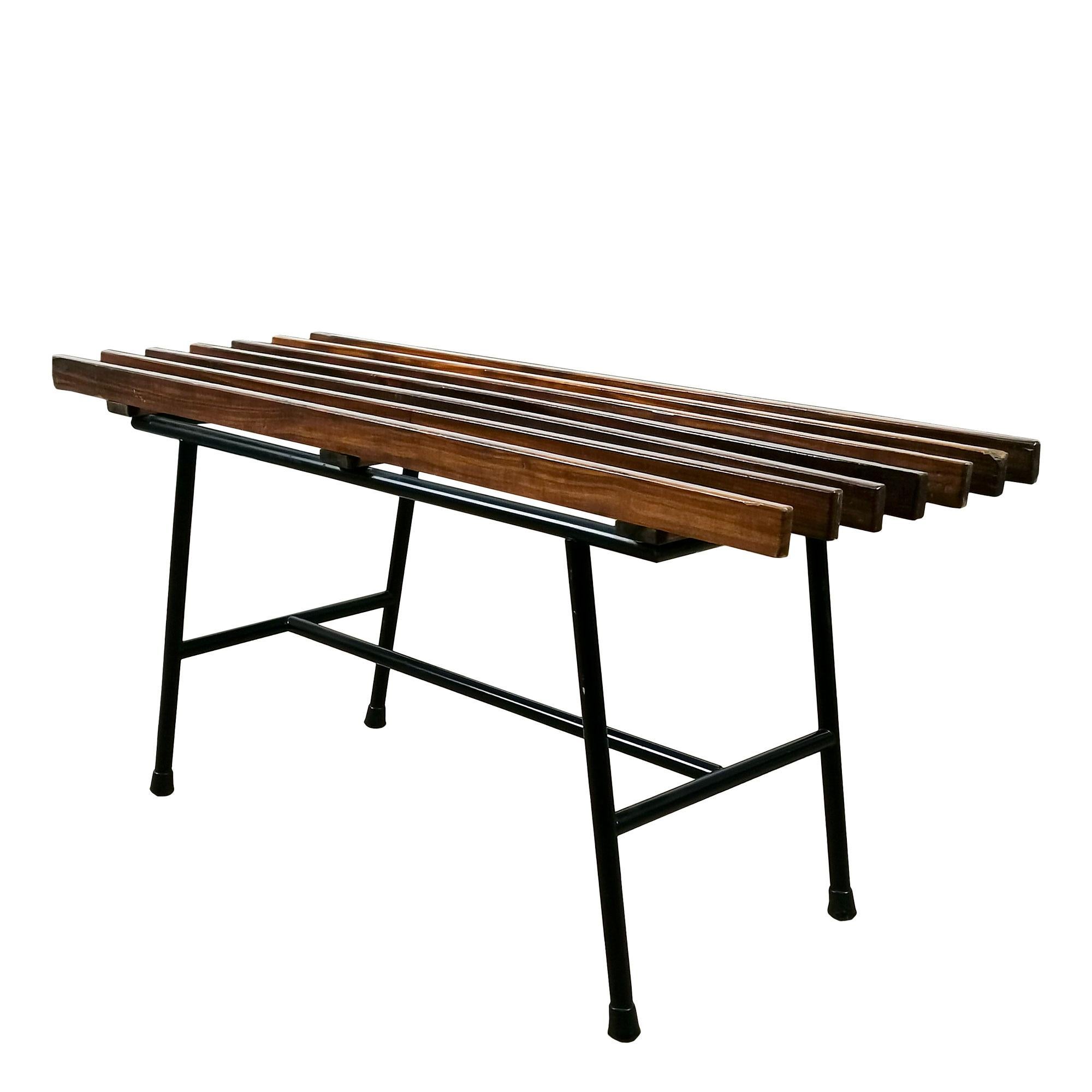 Pair of benches in solid mahogany slats which rest on a black tubular steel base ending in black plastic caps.

Italy c. 1960.

Dimensions: 

bench 1:  89 x 31 x 39 cm
bench 2: 80 x 31 x 39 cm