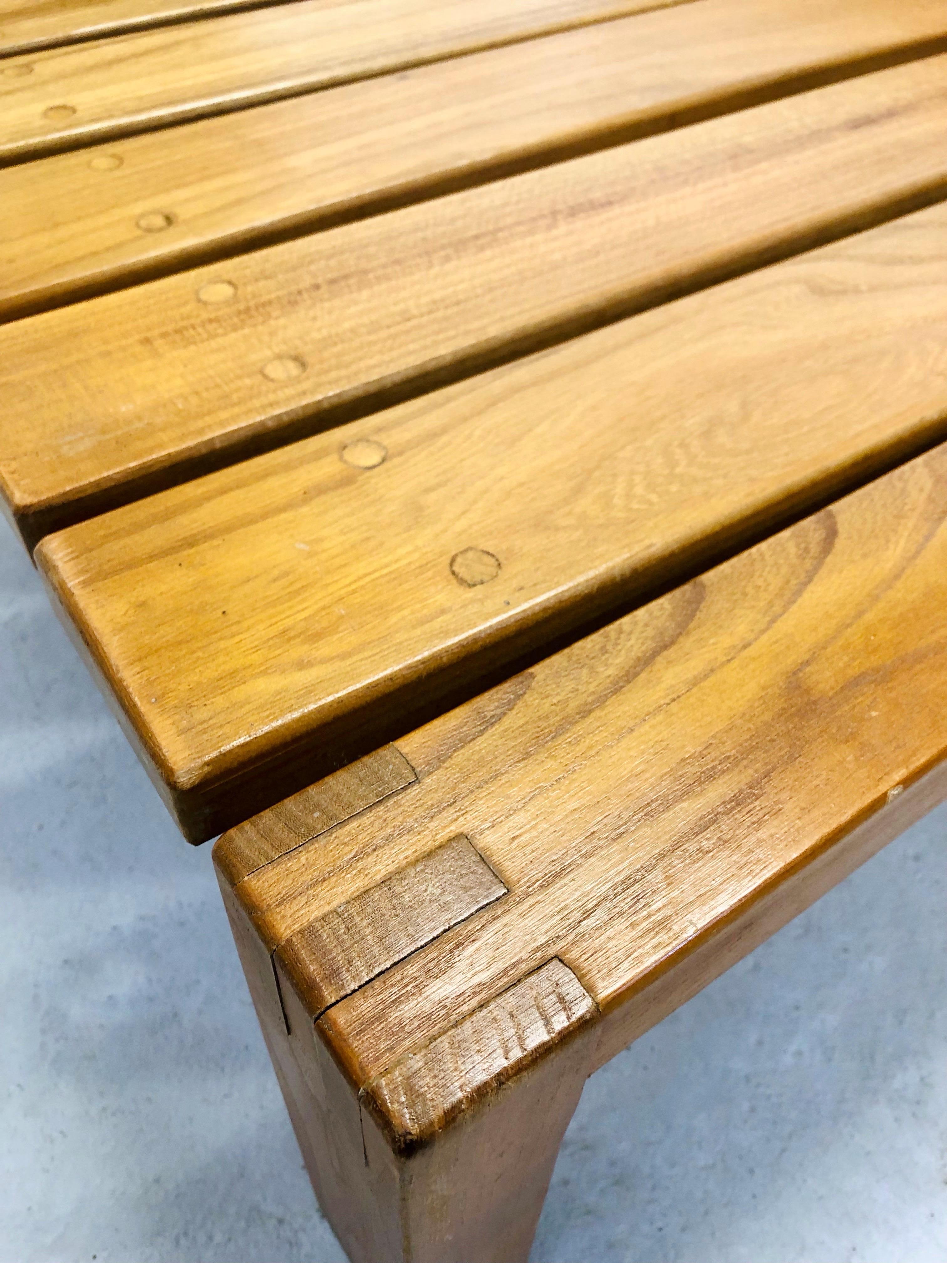 Exquisite Pair of Benches or Low Tables by Regain, France, from the 1970s. Crafted from beautiful elm wood. The original varnish beautifully preserves the wood, while the cushions and upholstery are brand new. Each bench features two fully removable